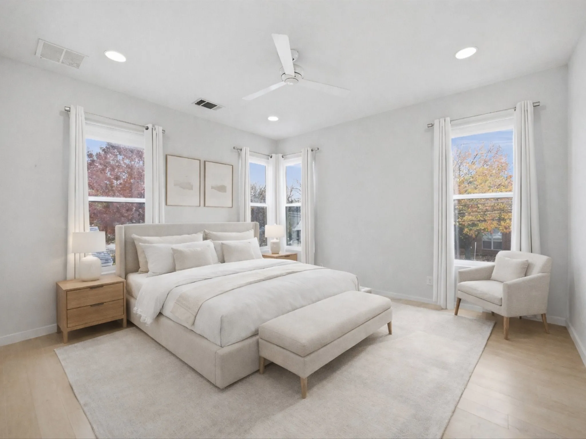 Bedroom featuring multiple windows, a ceiling fan, light wood-style flooring, and recessed lighting