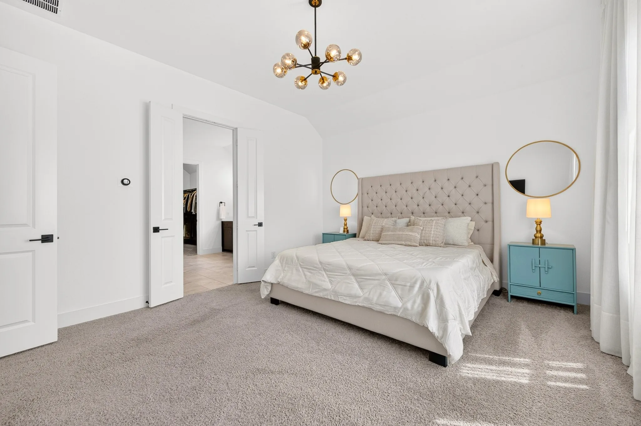 Plush carpeting and a modern chandelier