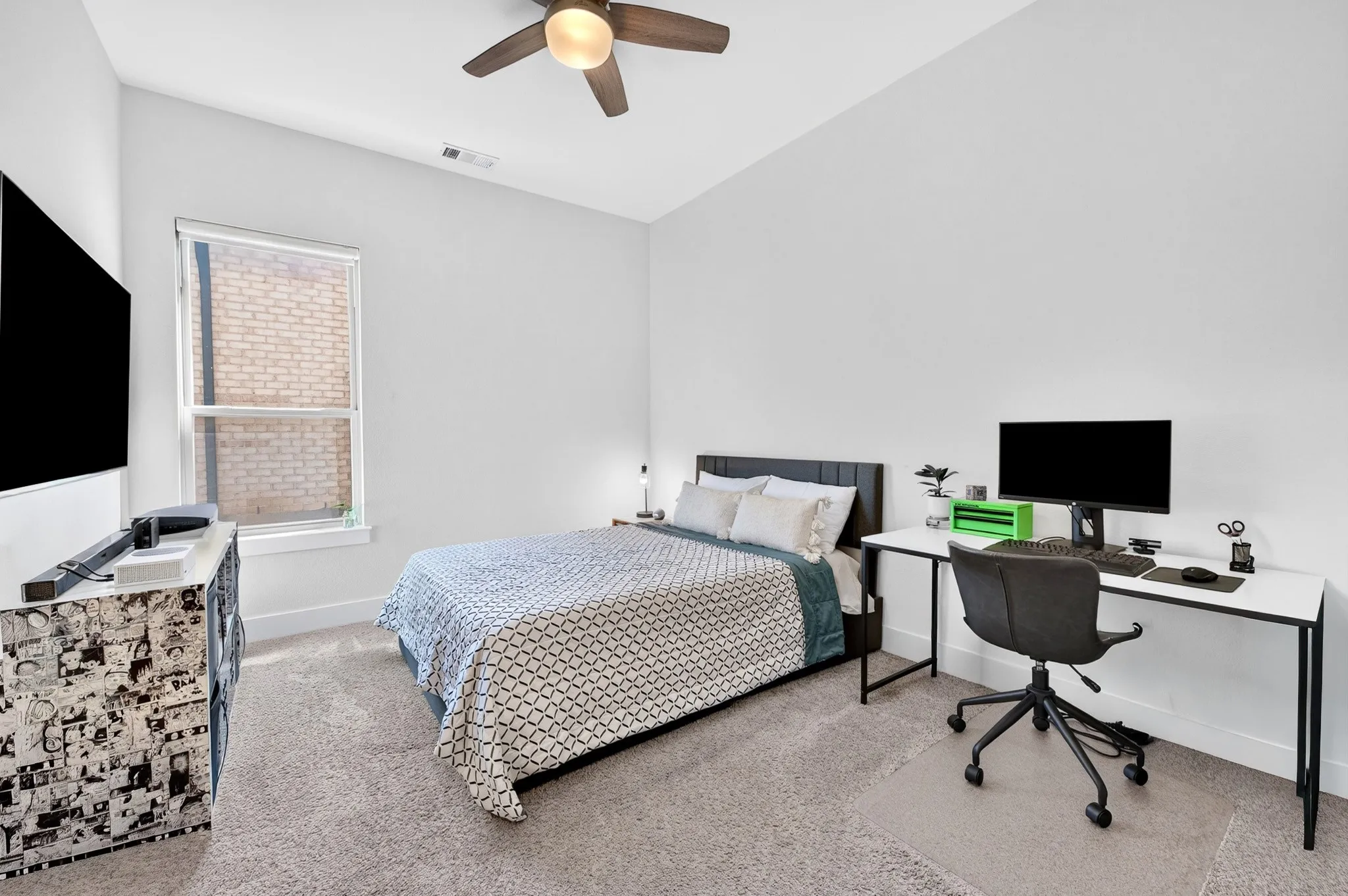 Carpeted room with high vaulted ceilings, a ceiling fan, and a single window