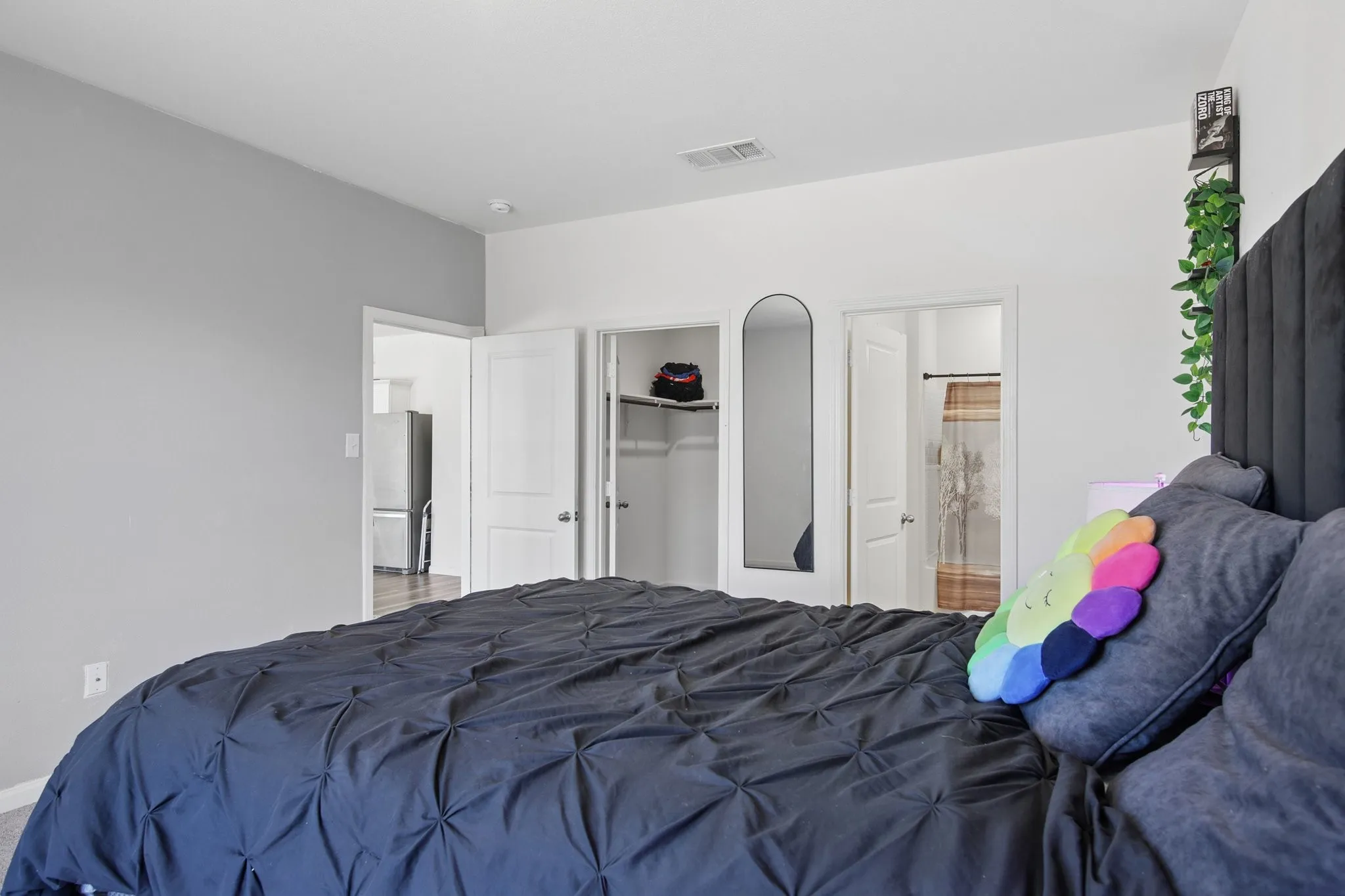 Primary bedroom is off of the living room and split from other 2 bedrooms.