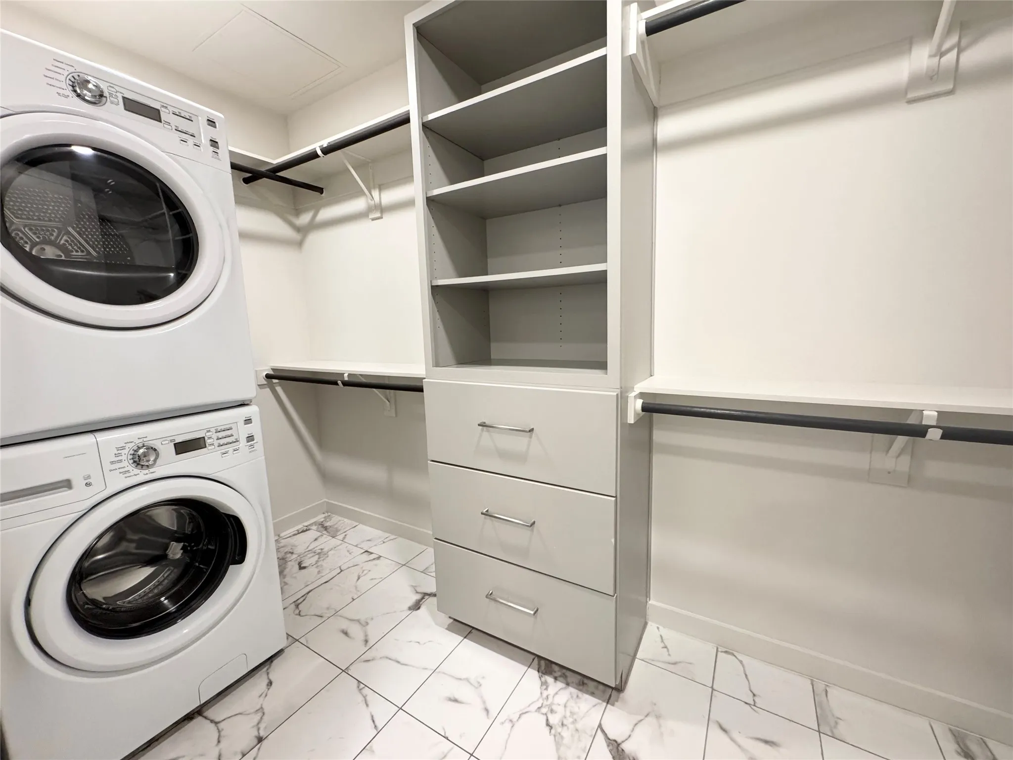 Laundry area with stacked washer / dryer