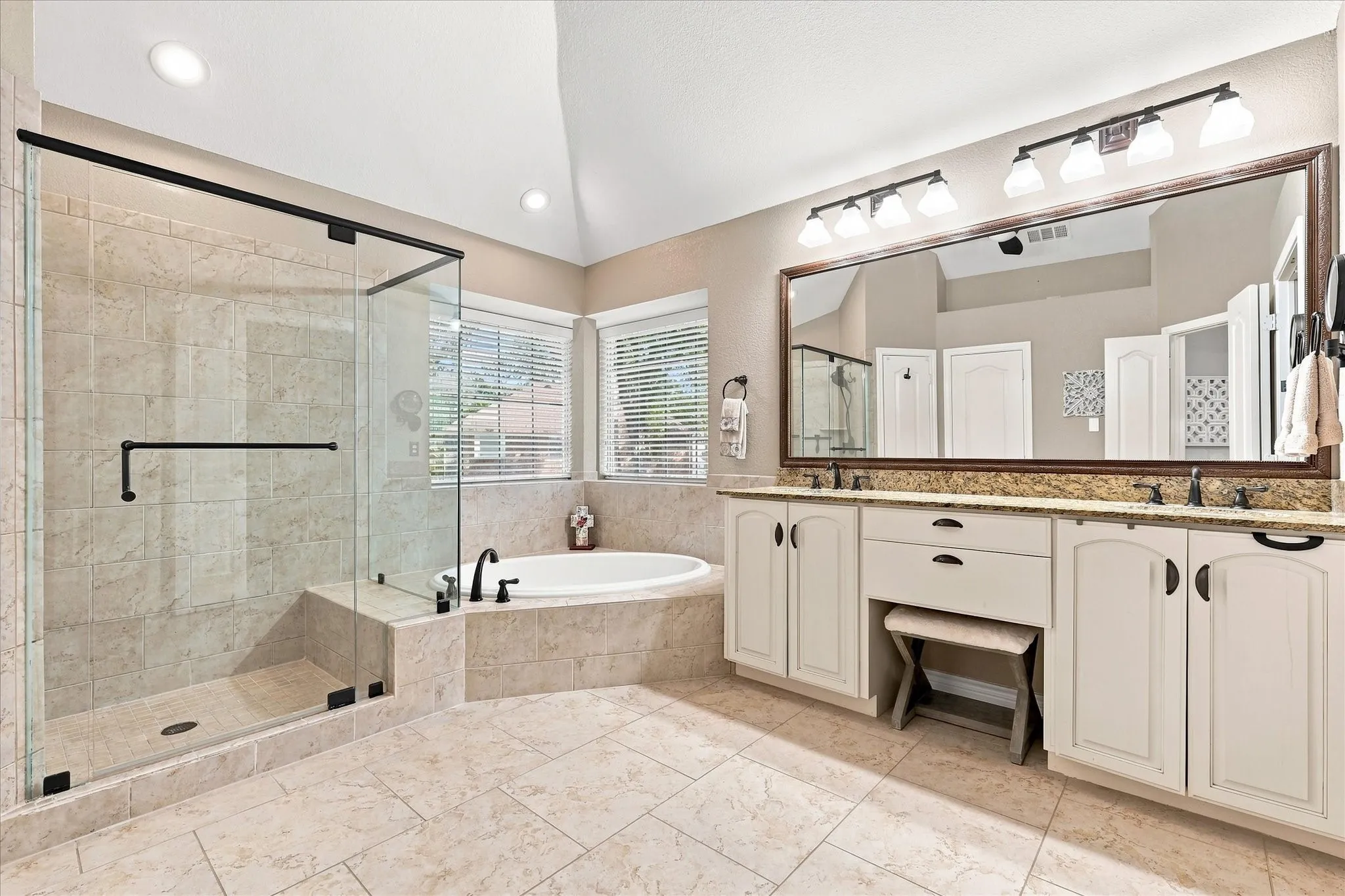 Dual sinks, garden tub & separate shower in the primary ensuite
