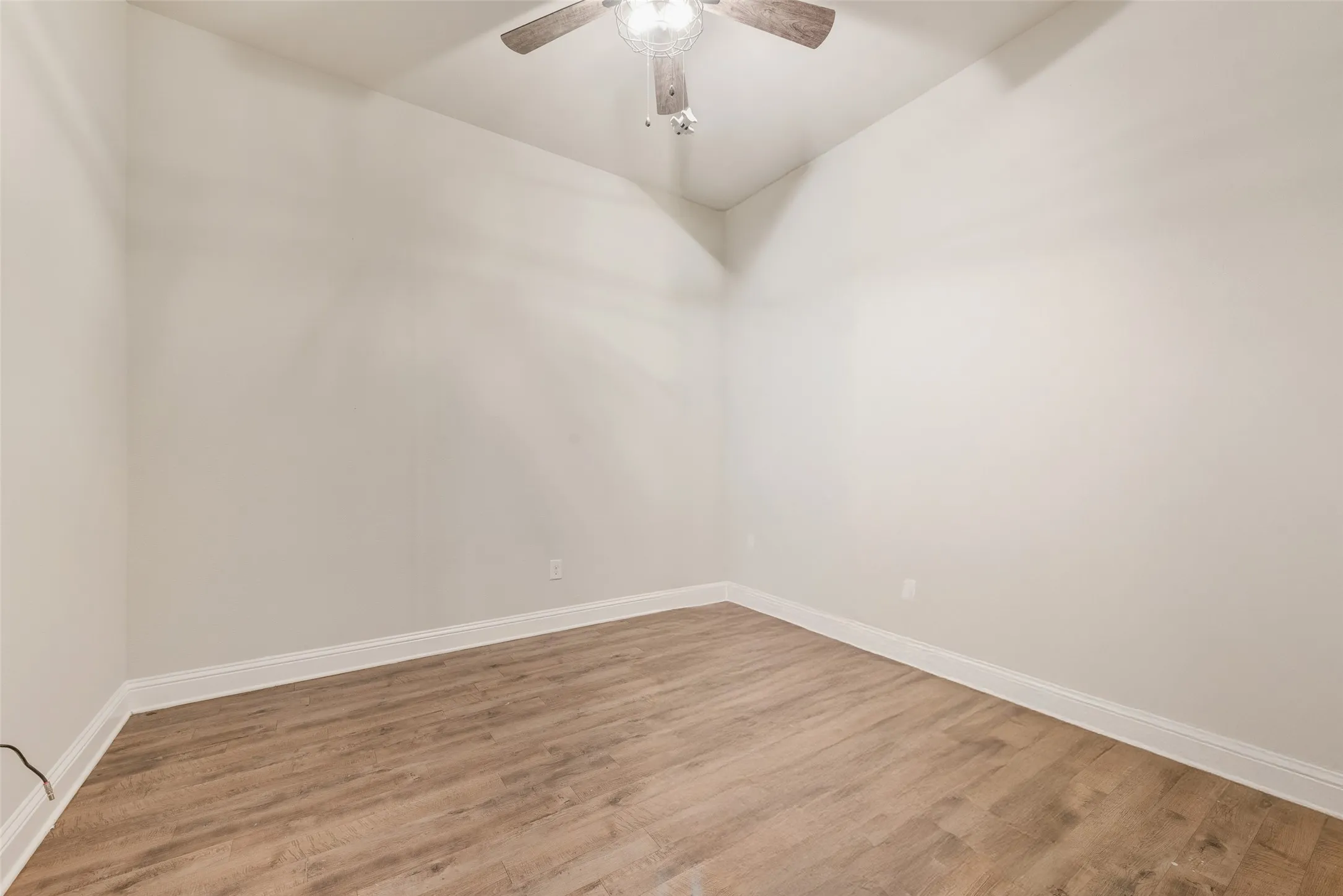 Recessed lighting, wood-finish flooring, and a ceiling fan with light fixture