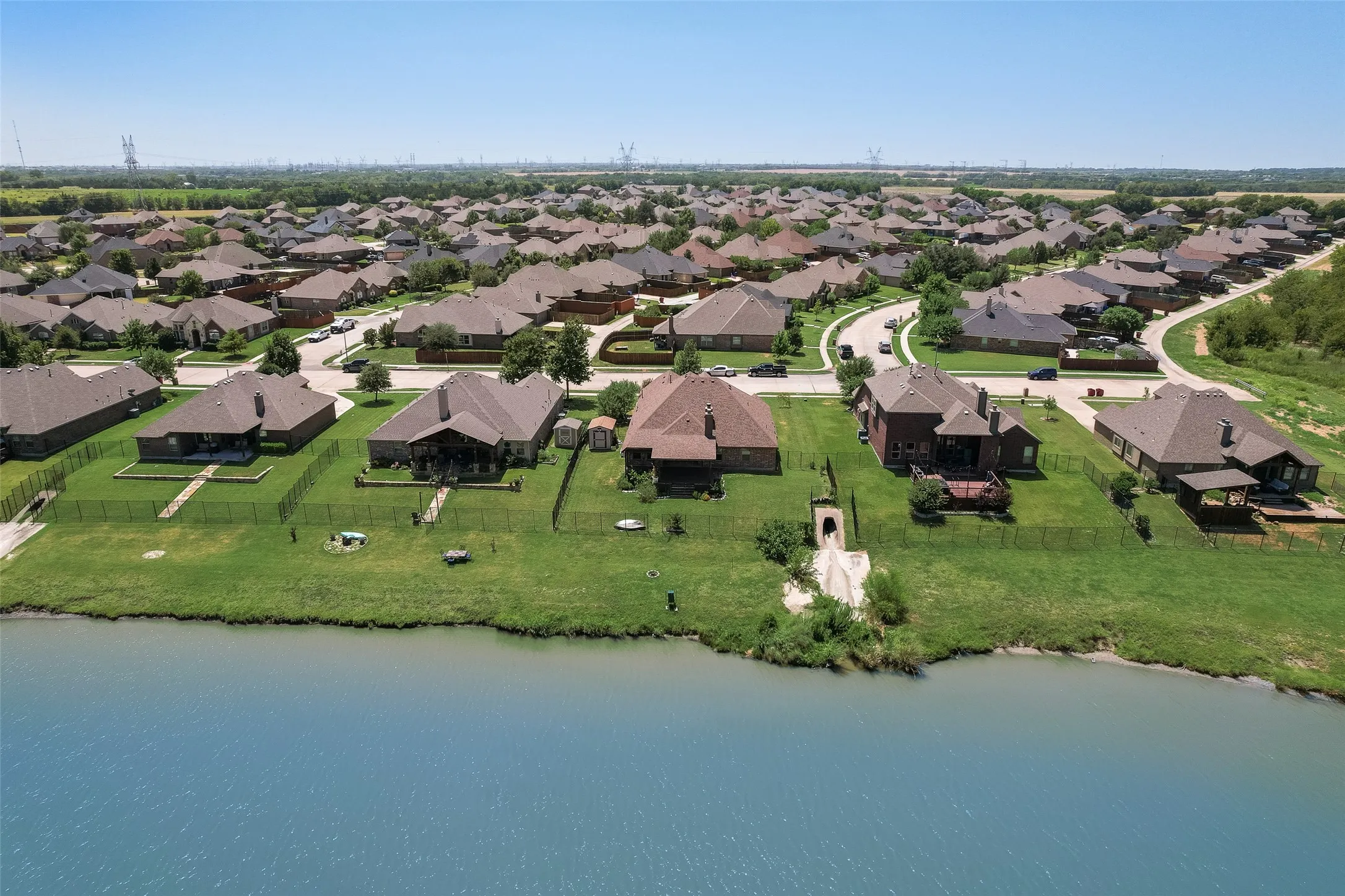 Lakeside properties with expansive green spaces and fenced rear yards