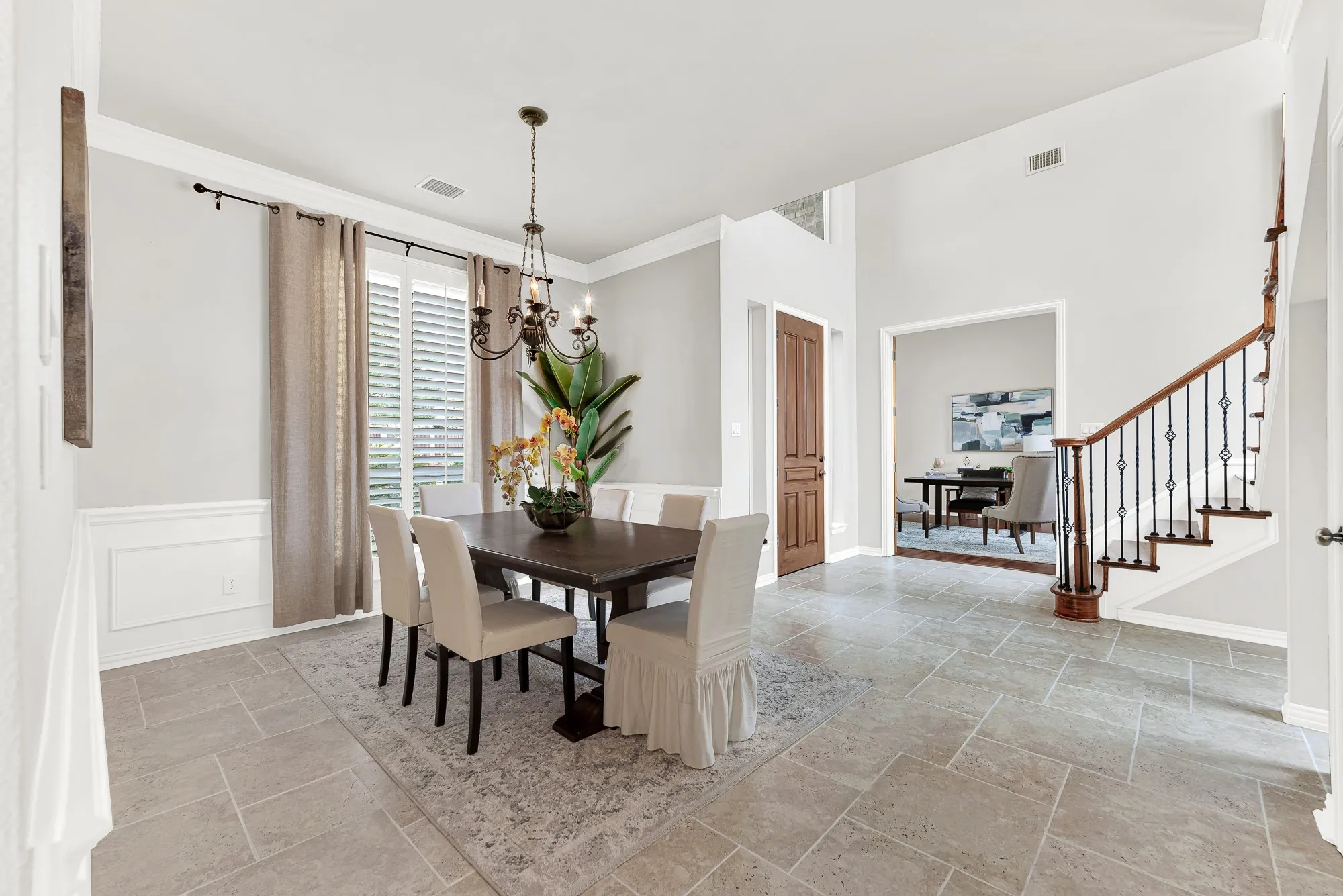 An open architectural flow smoothly connects the dining space to the main foyer and adjacent rooms. You can effortlessly host holiday celebrations where guests wander seamlessly between warm, welcoming areas