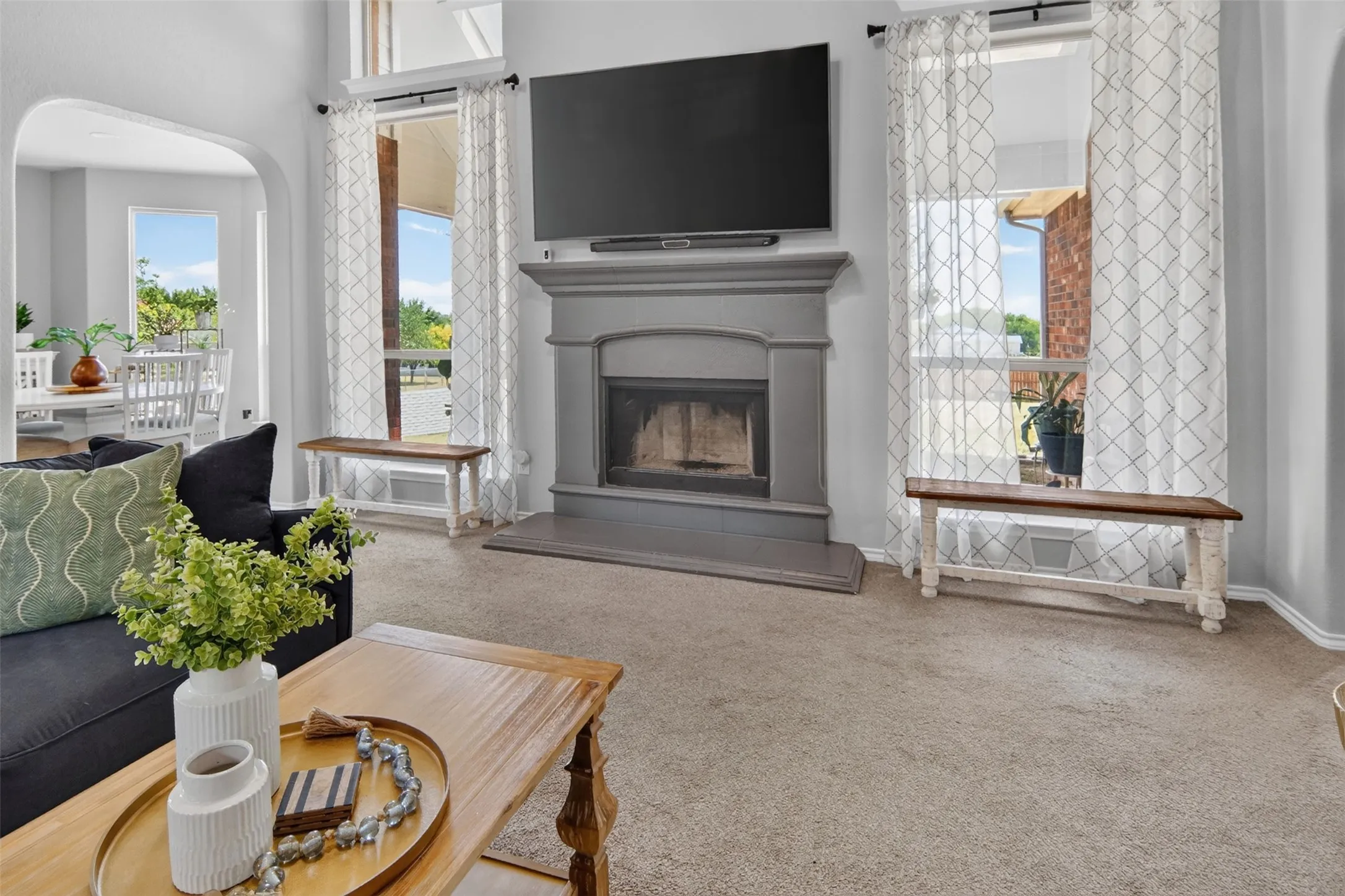 wood burning fireplace with great view of the fenced backyard