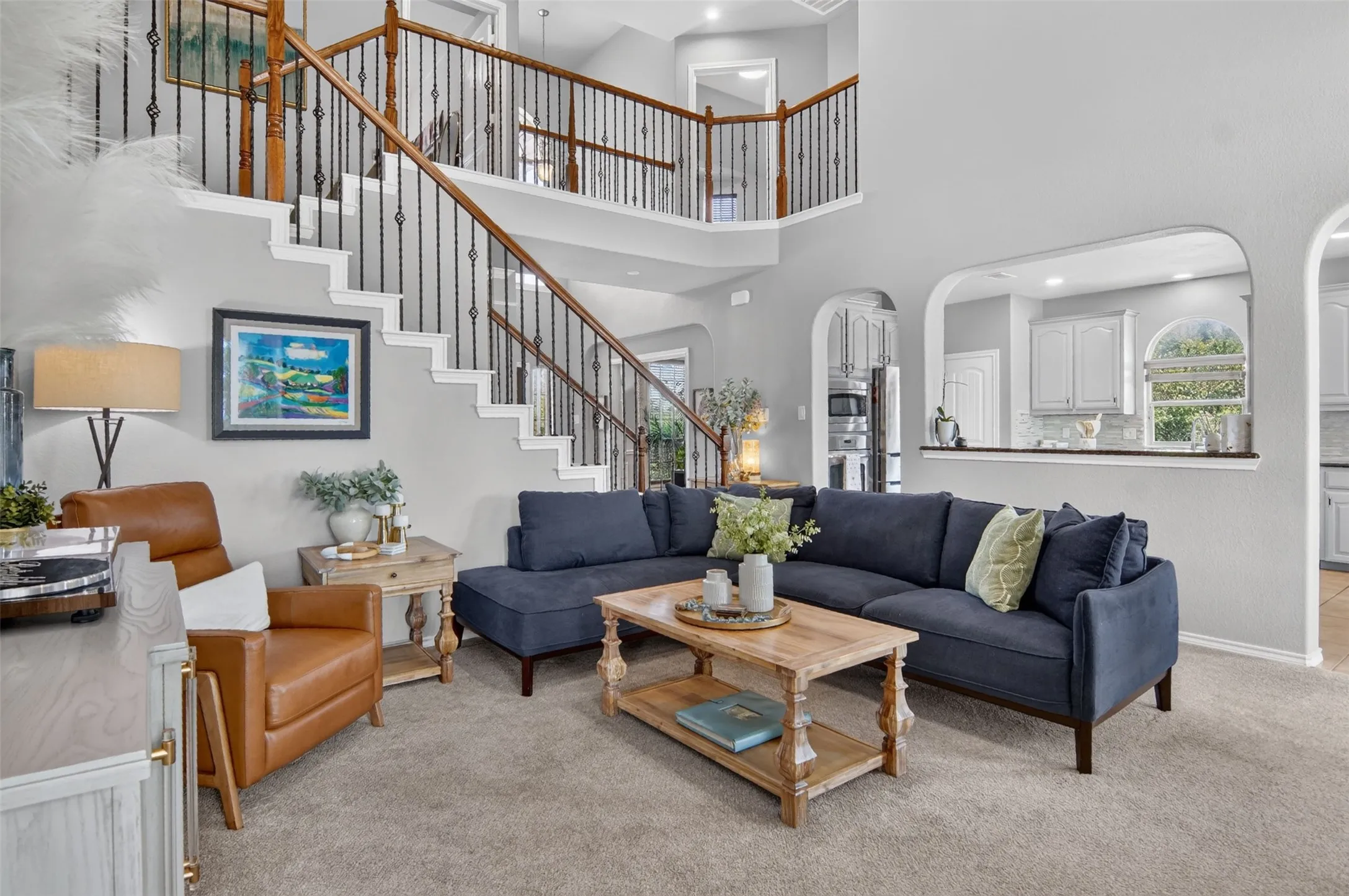 open to the kitchen, office, and extra bedrooms.