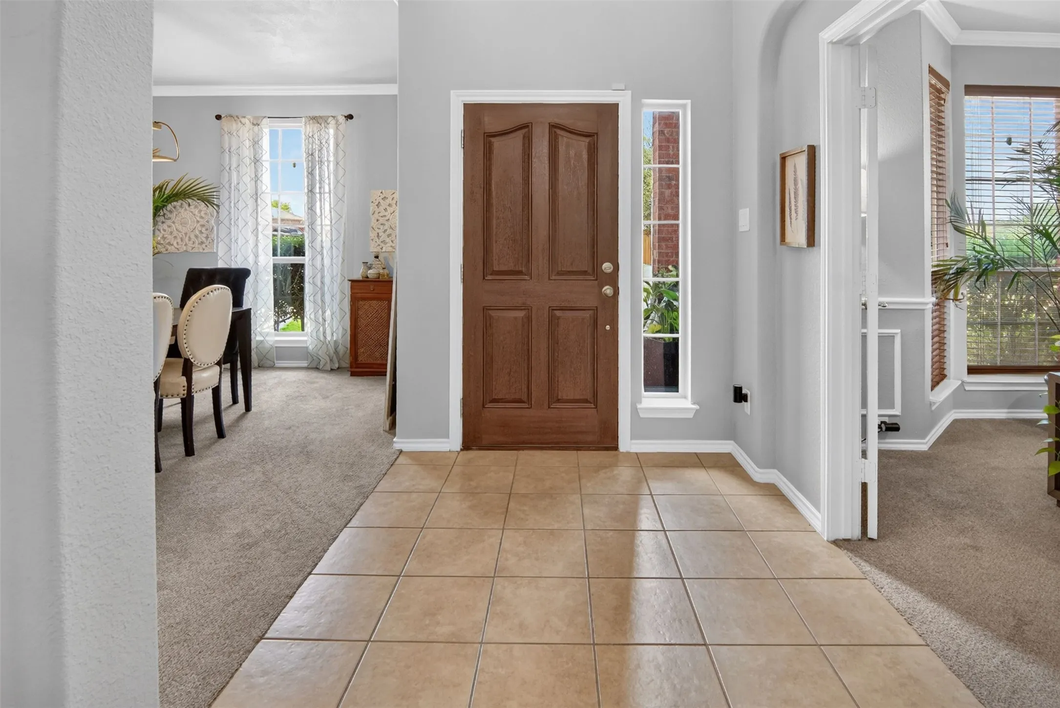 spacious entry with formal dining to the right and office to the left