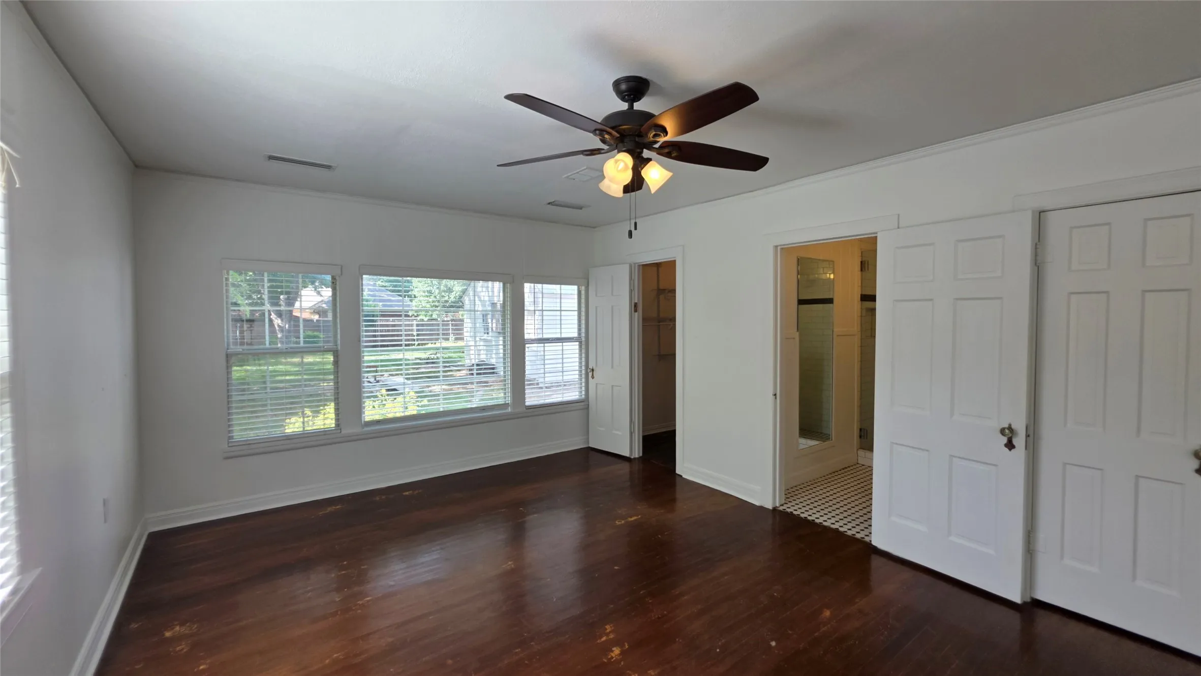 Downstairs, Primary Suite 1 of 2. In addition to the closet under the staircase, there is a separate walk-in closet.