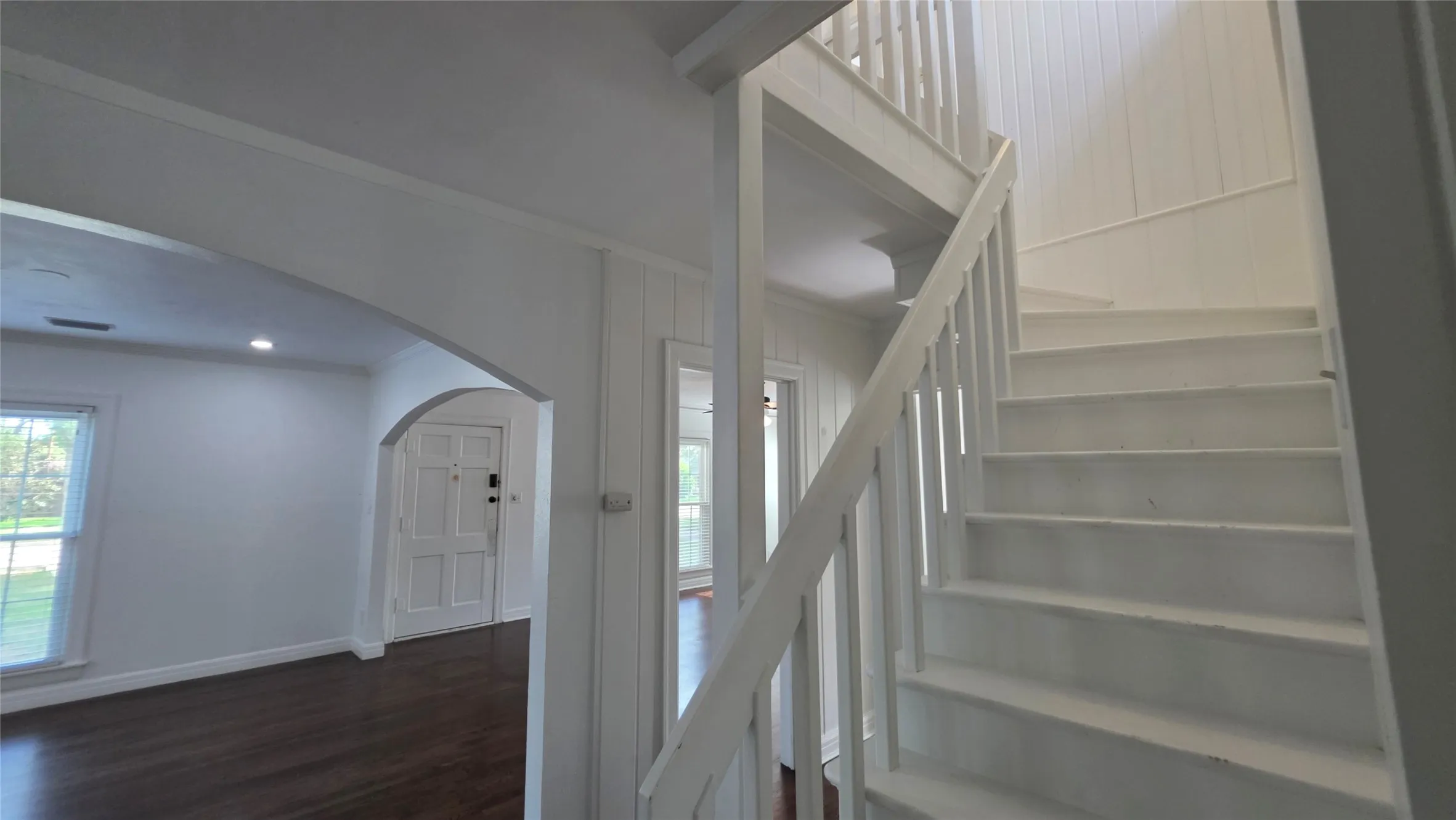 Staircase leads to two additional bedrooms, and an additional bathroom.