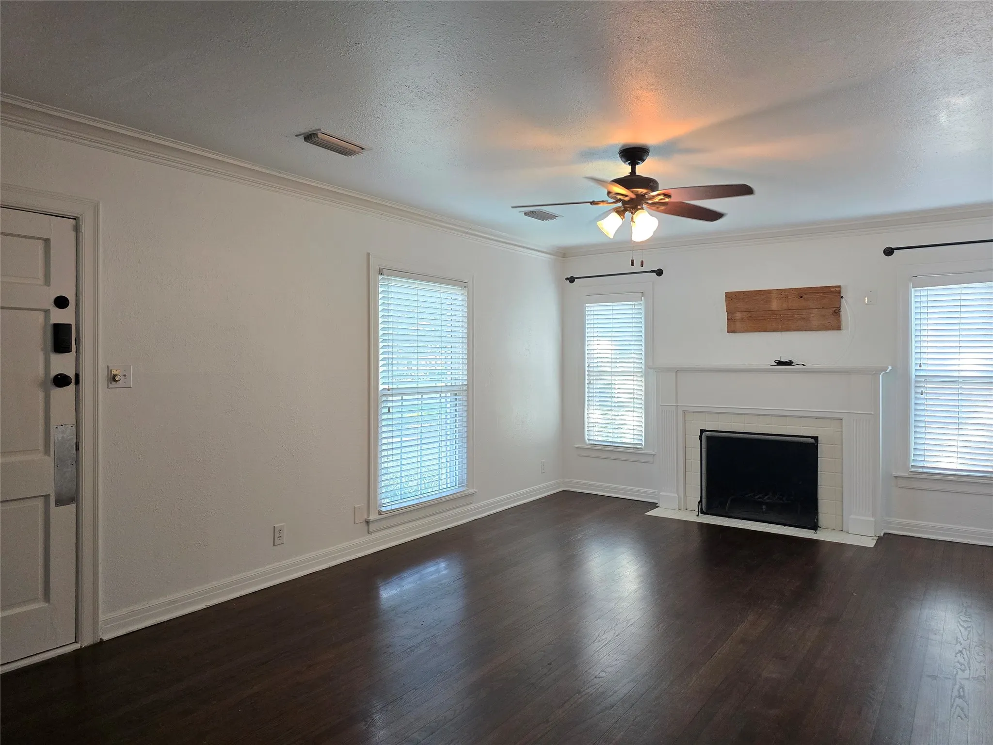 Window blinds installed throughout this home. Wood floors.
