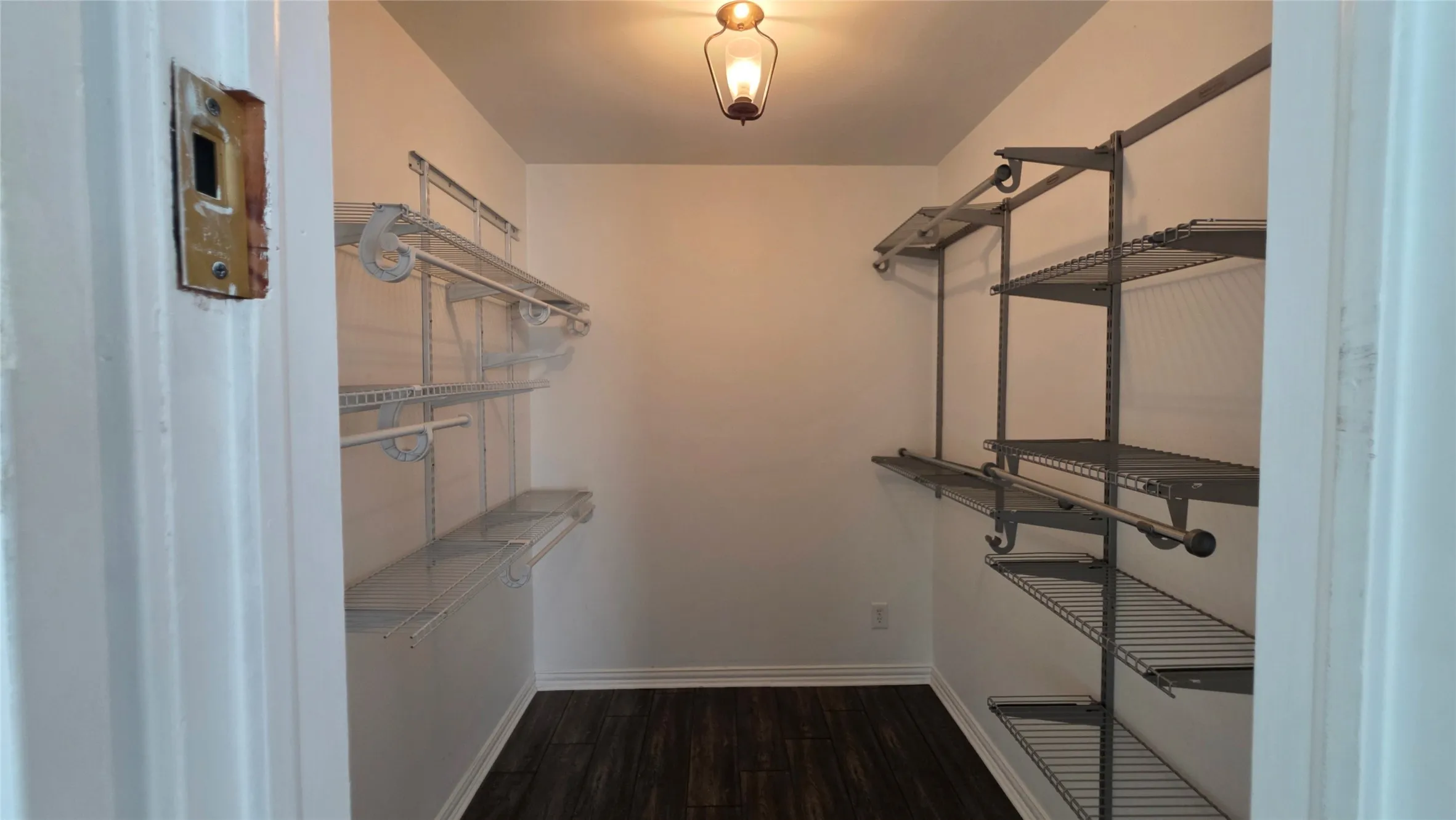 Walk-in closet with customizable organizers and a vintage light!