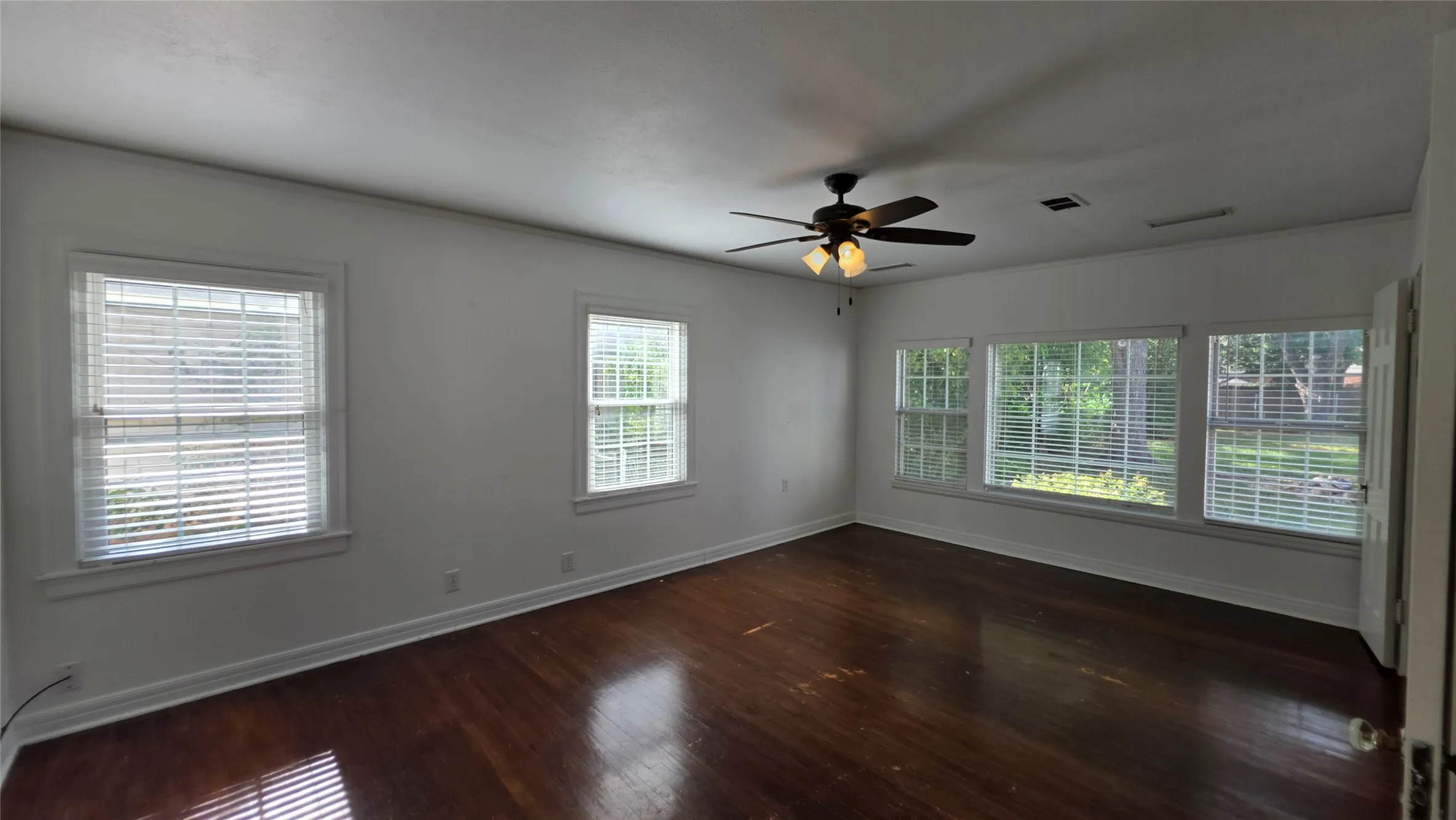 Downstairs, Primary Suite 1 of 2 has plenty of natural lighting.