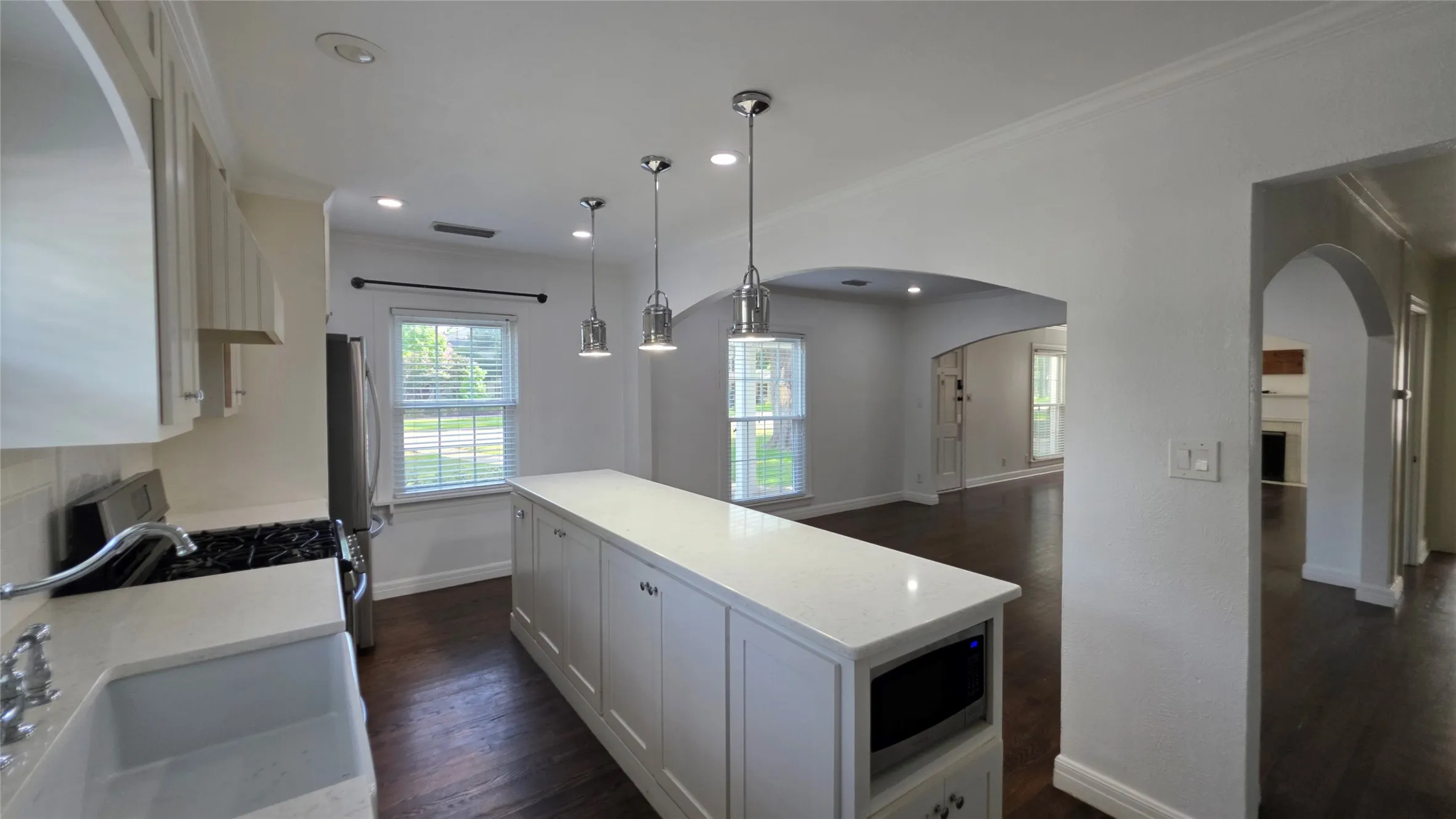 Updated granite countertops, modern lighting, and neutral palate to fit your own decor.