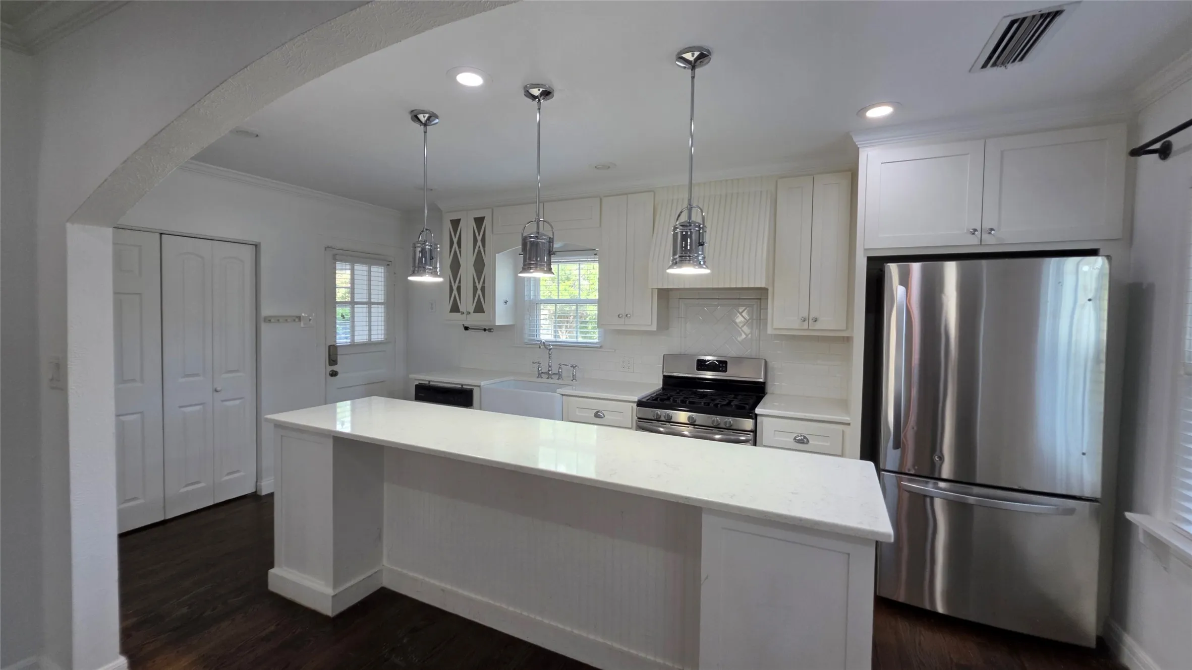 Kitchen island doubles as a breakfast bar. Lots of pantry space in multiple closets.