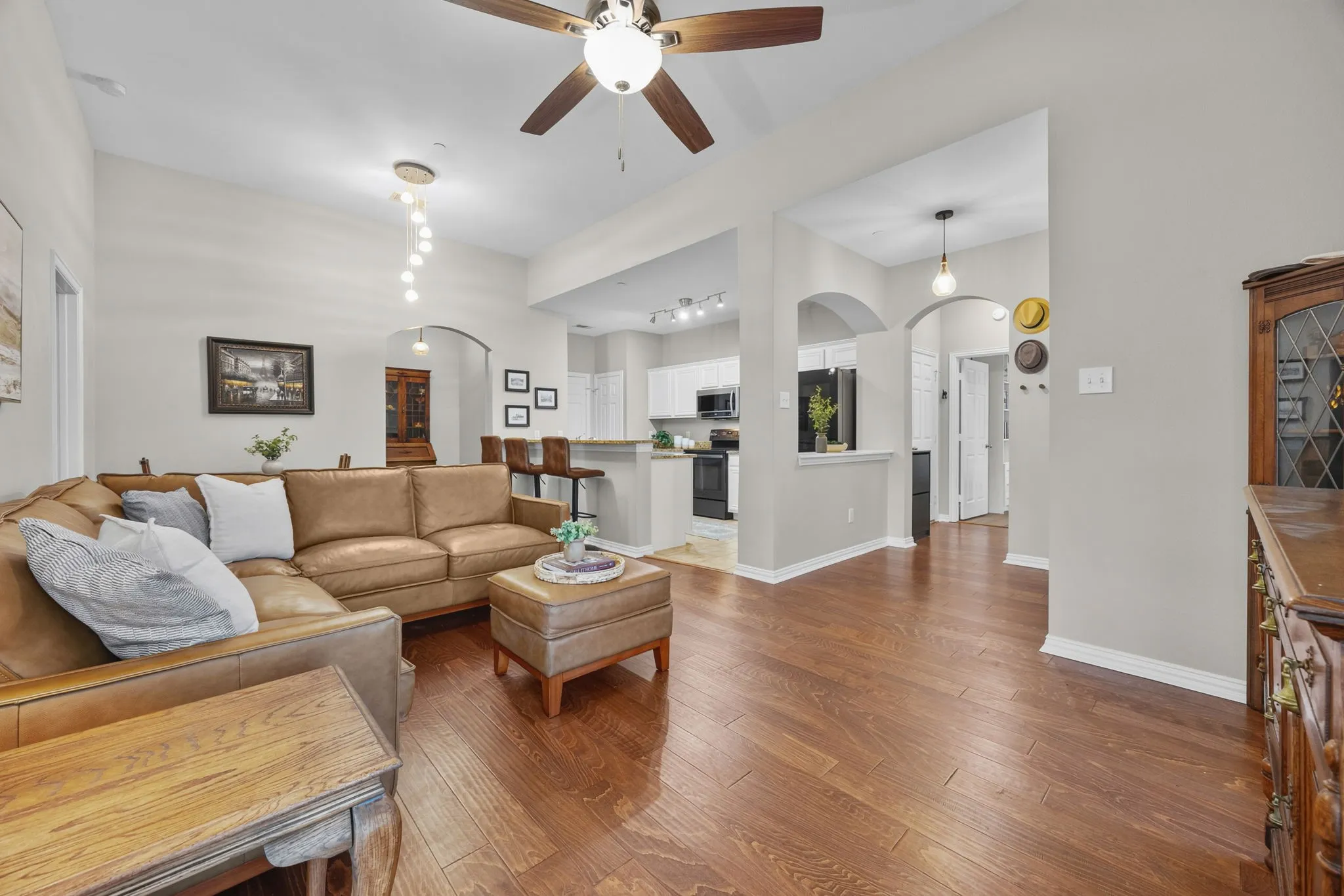 Rich wood-finish flooring complements the neutral wall tones