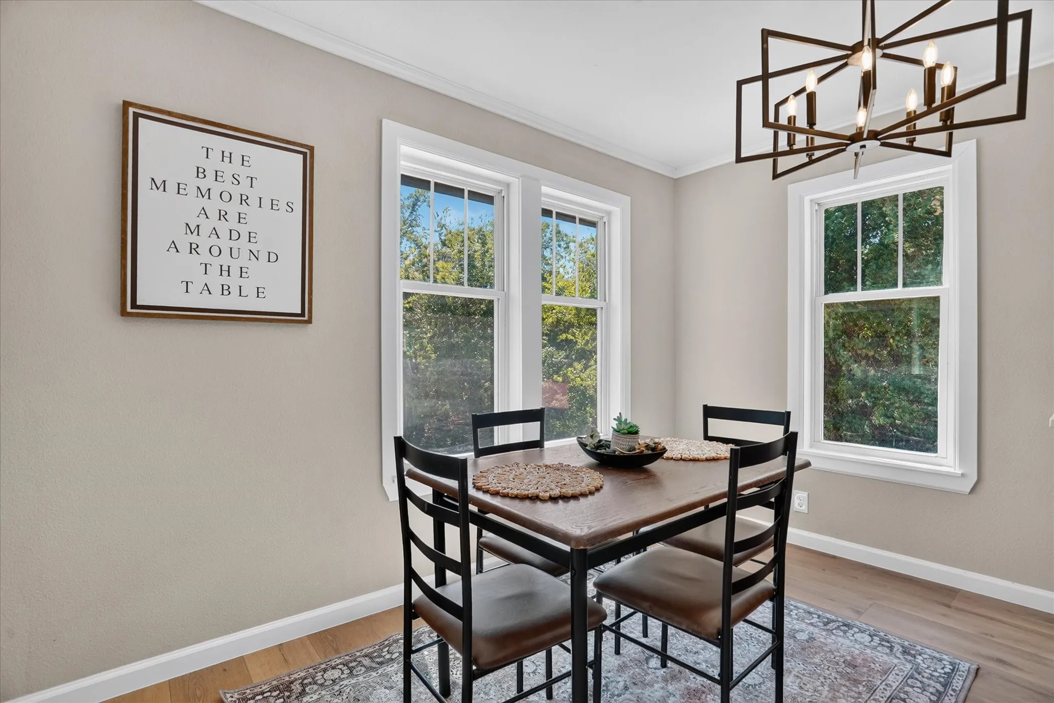 Recessed lighting, wood-finish flooring, white trim, and multiple windows