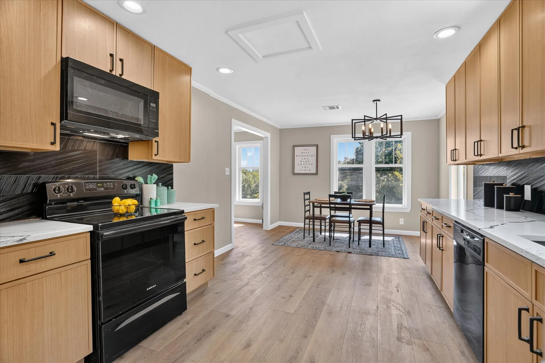 Wood-finish flooring throughout the kitchen and dining area