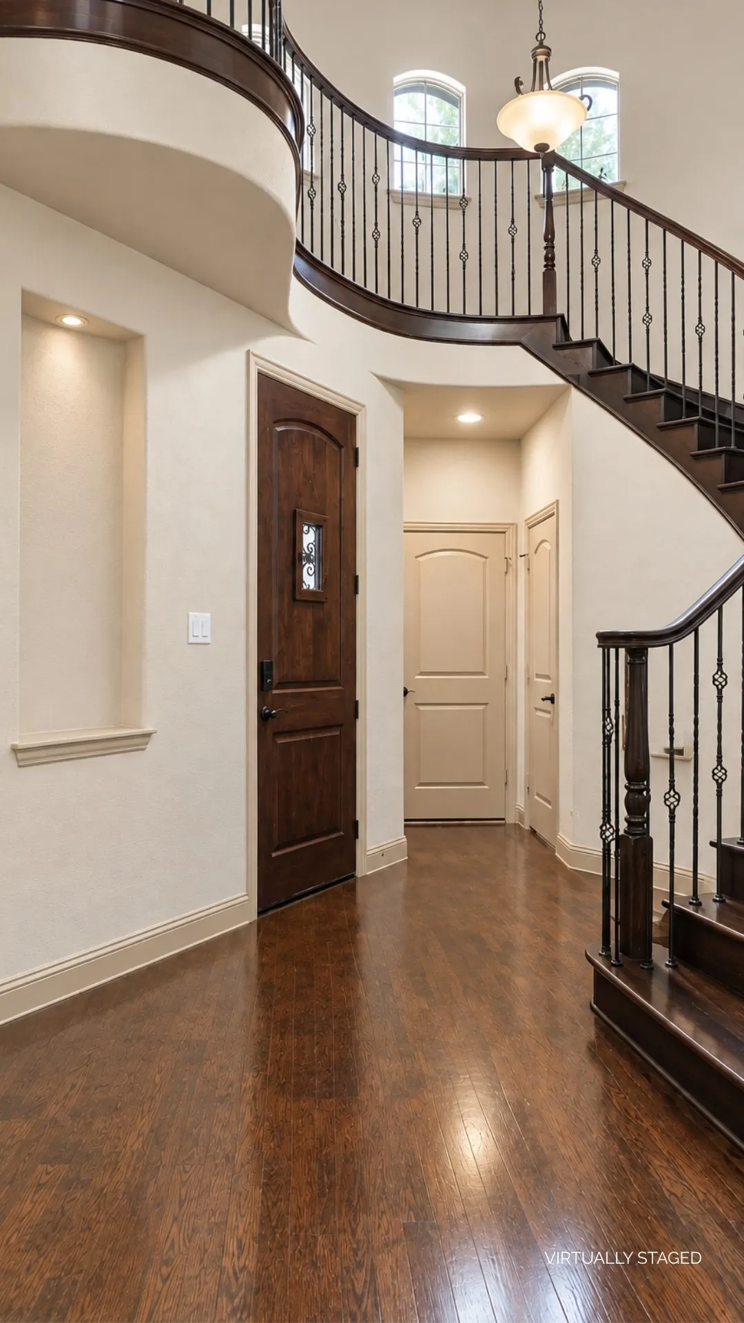 Front entry foyer showcasing the beautiful wooden spiral staircase