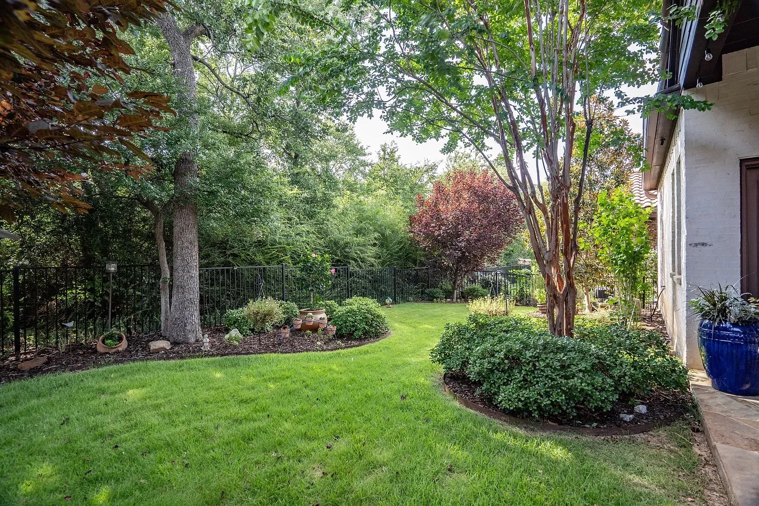 Tranquil fenced backyard retreat facing greenbelt