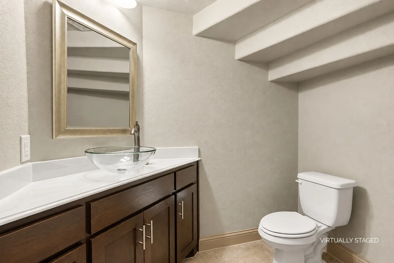 Downstairs Half Bath Located Under Stairs
