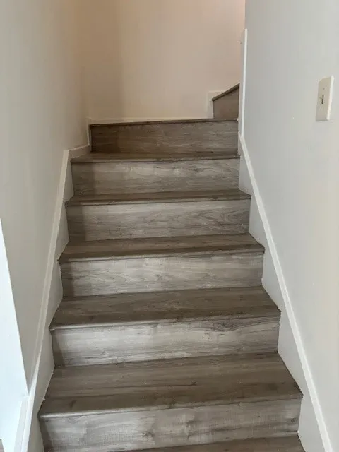 Stairs with wood finished floors