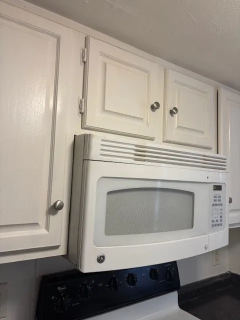 Detailed view of white microwave