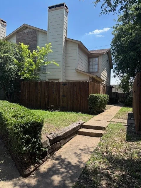 View of home's exterior with a chimney