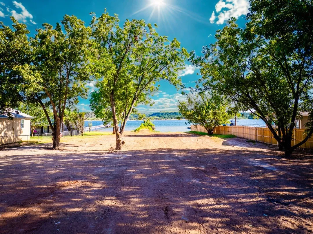 The Lot with 0.629acres of open Level Space and Walk In Lake Access and Sandy Beach
