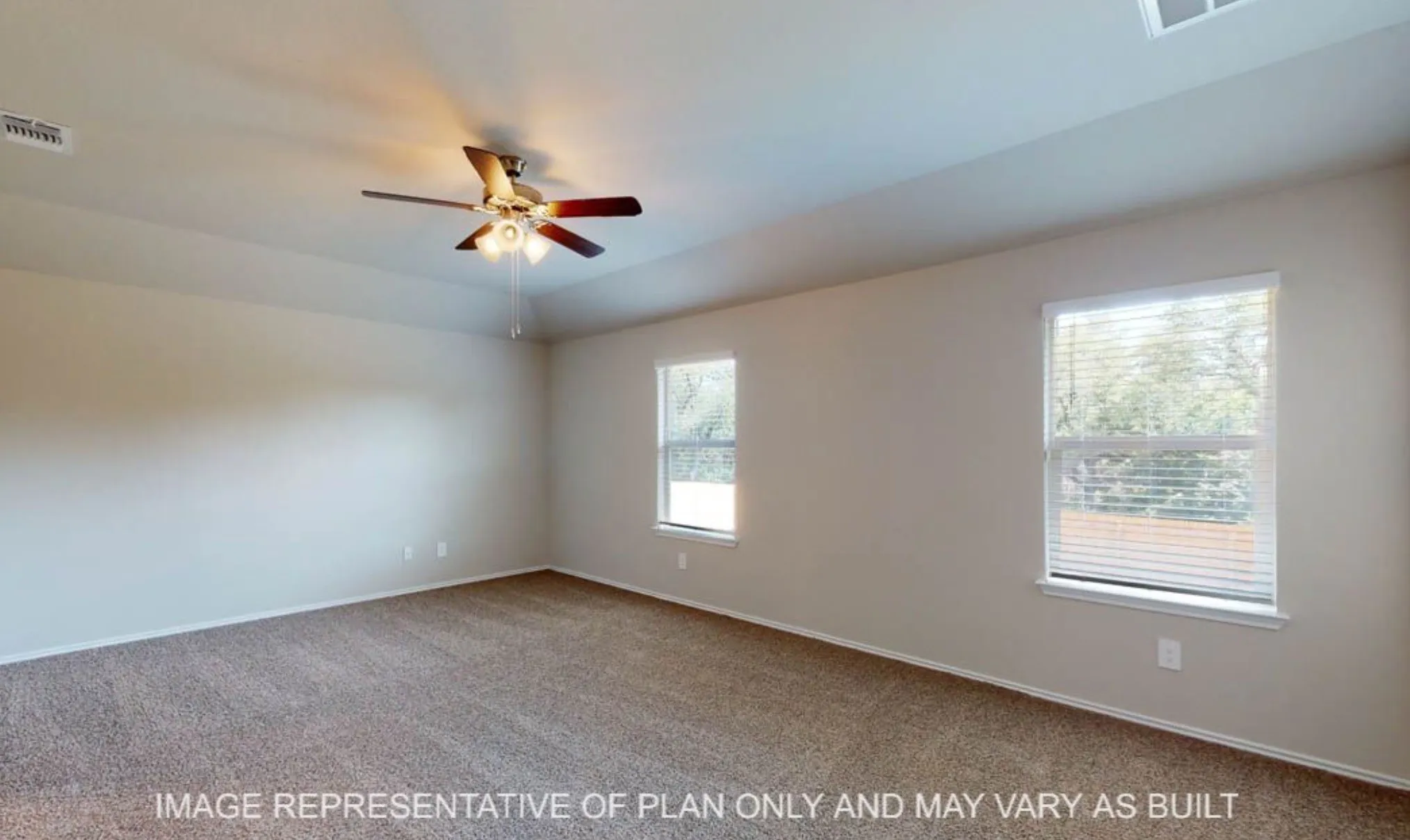 Carpeted room with a ceiling fan, dual windows, and neutral wall tones