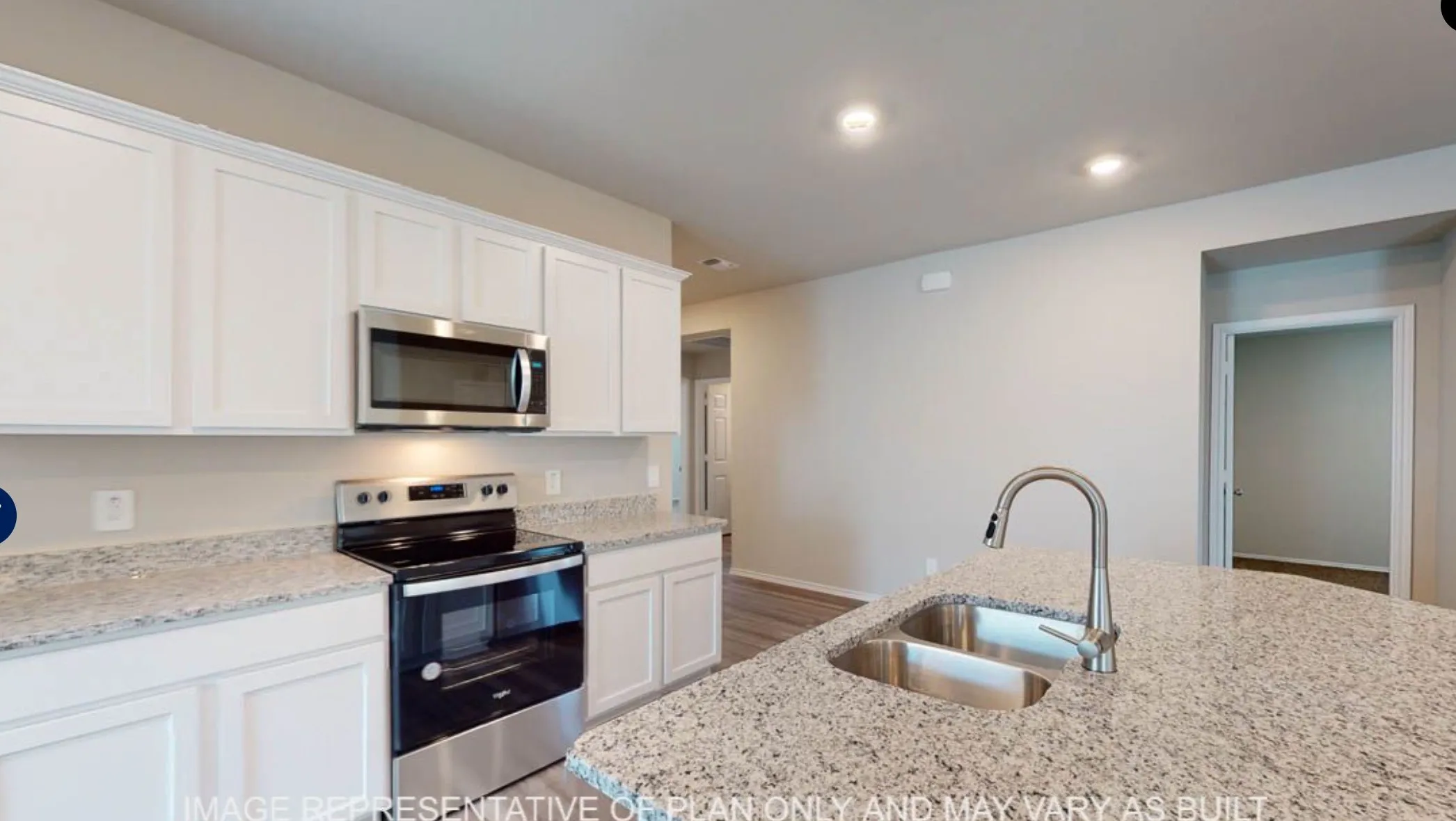 Kitchen featuring white cabinetry, stainless steel appliances, a double basin sink, and granite countertops