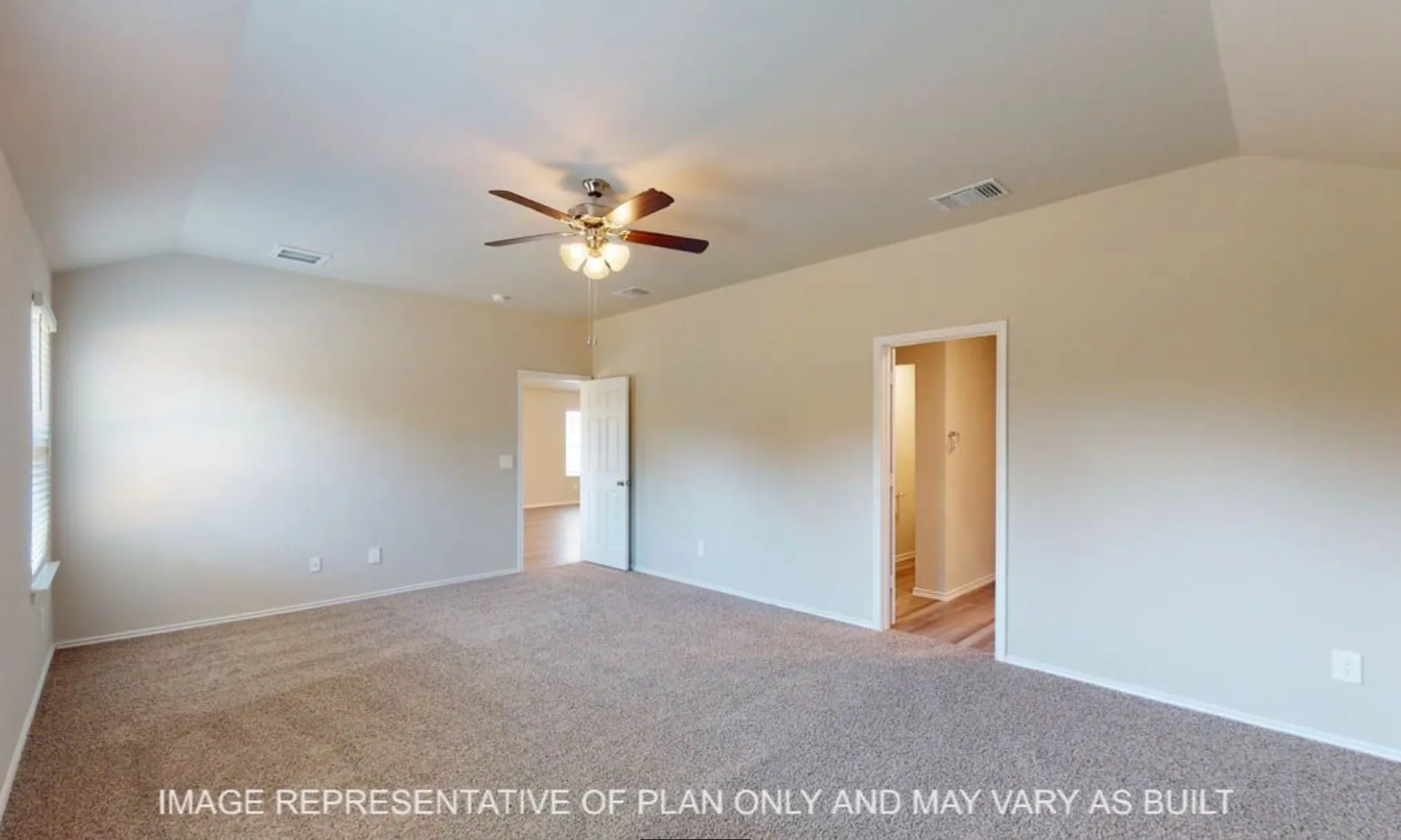 Vaulted ceiling, ceiling fan with integrated lighting, carpeted flooring, two paneled doors, and a window with blinds
