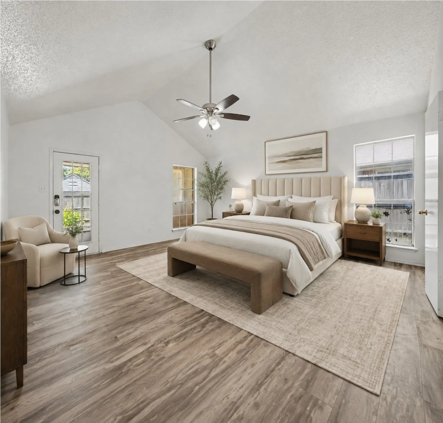 AI Staging.Vaulted ceiling with ceiling fan, wood-finish flooring, multiple windows, and a glass-paneled exterior door
