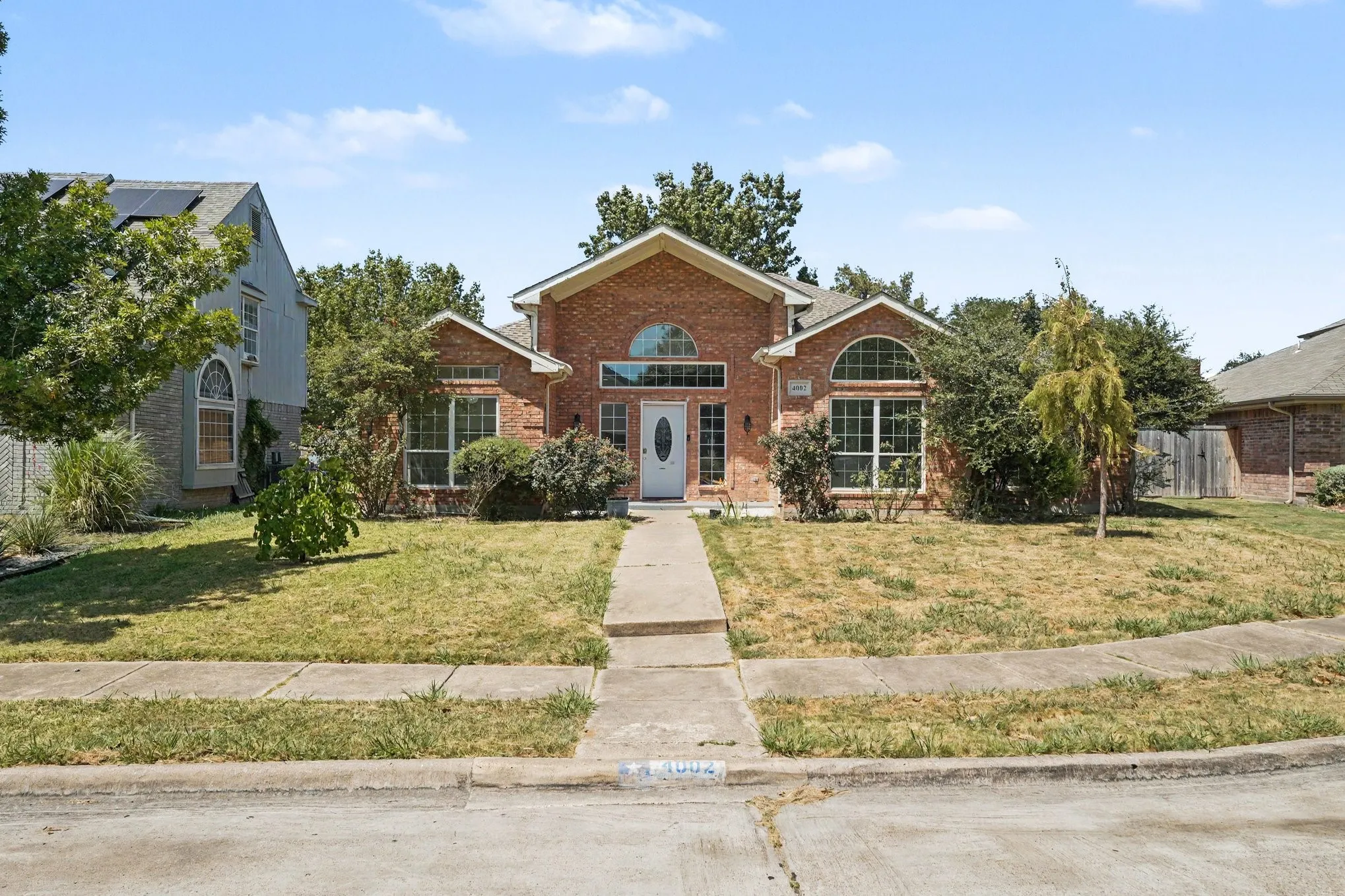 Brick exterior with an arched entryway and keystone detailing