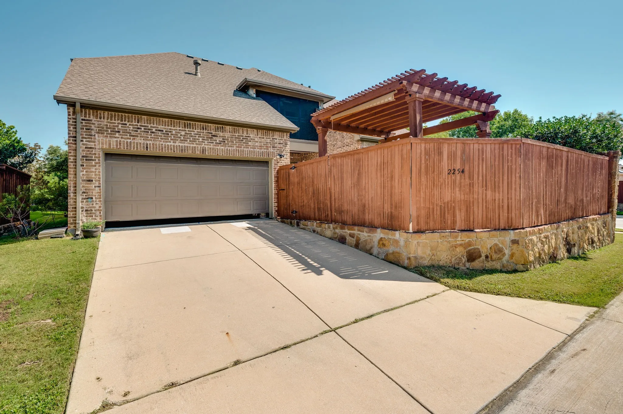 Brick exterior with a two-car garage