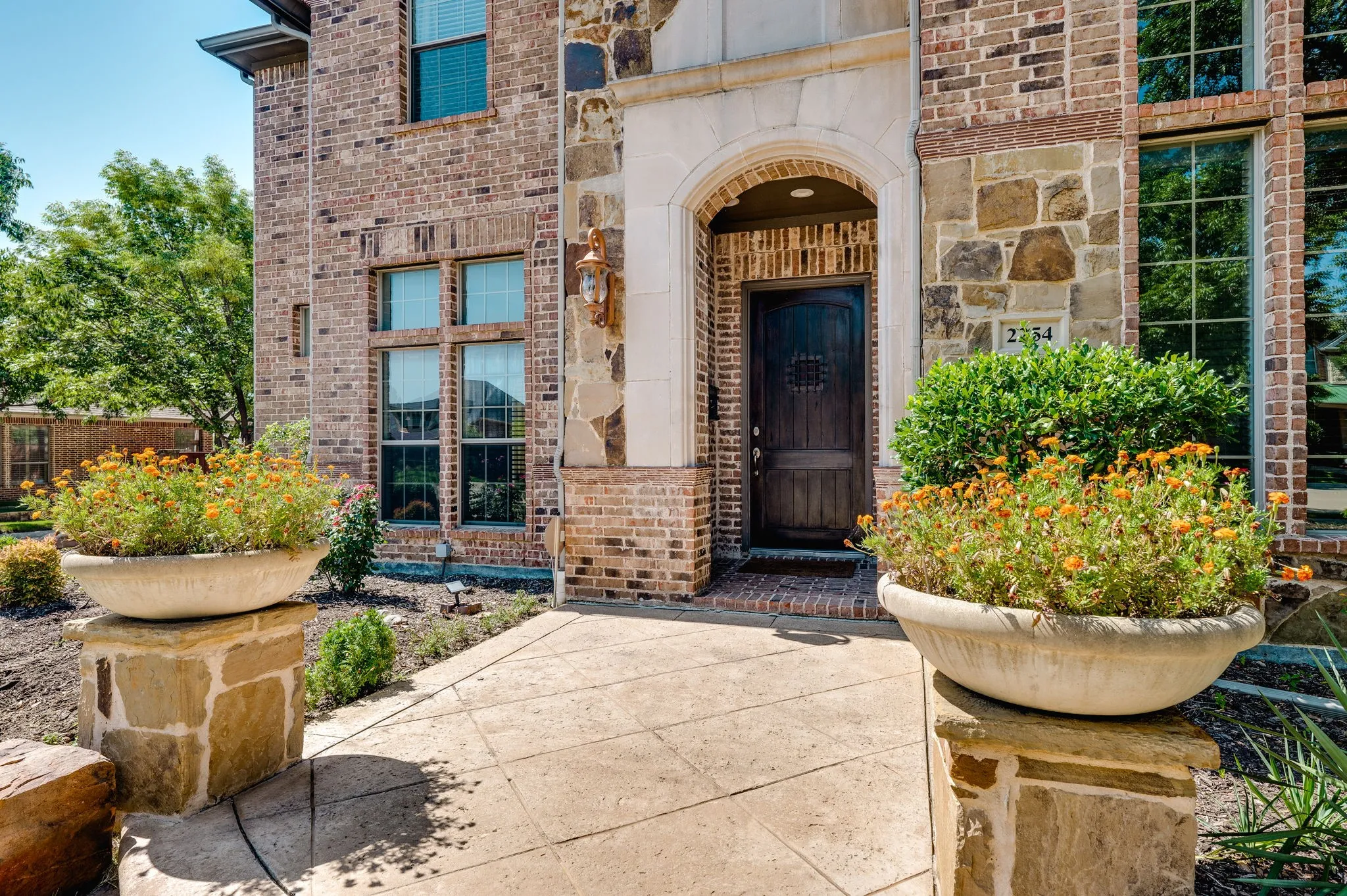 Brick and stone exterior with arched entryway