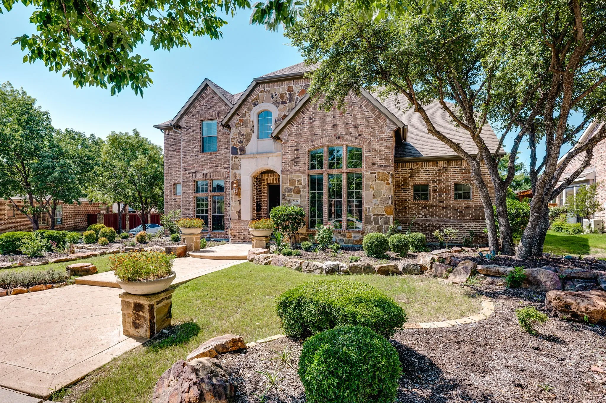 Brick and stone façade with arched entryway