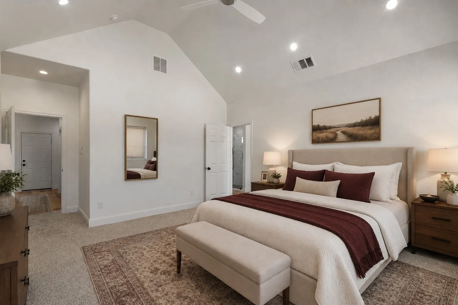 Vaulted ceiling with recessed lighting, ceiling fan, and light gray carpeting
