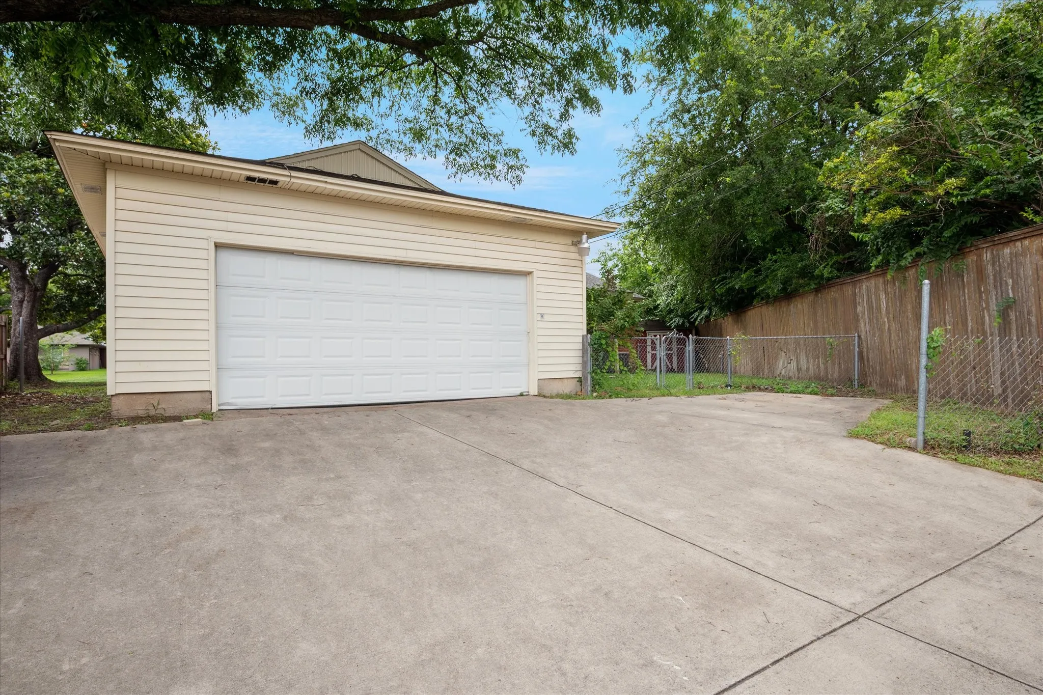 Oversized, attached, rear entry garage with electrical outlets and great storage. Also an additional parking space