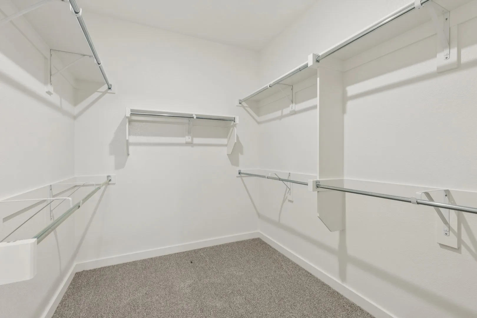 Primary Closet in the Masters home plan by Trophy Signature Homes – REPRESENTATIVE PHOTO