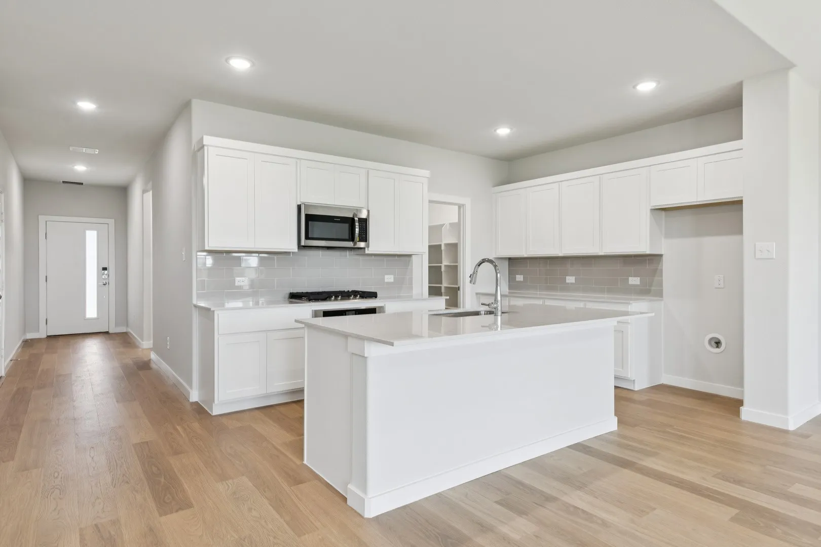 Kitchen in the Masters home plan by Trophy Signature Homes – REPRESENTATIVE PHOTO