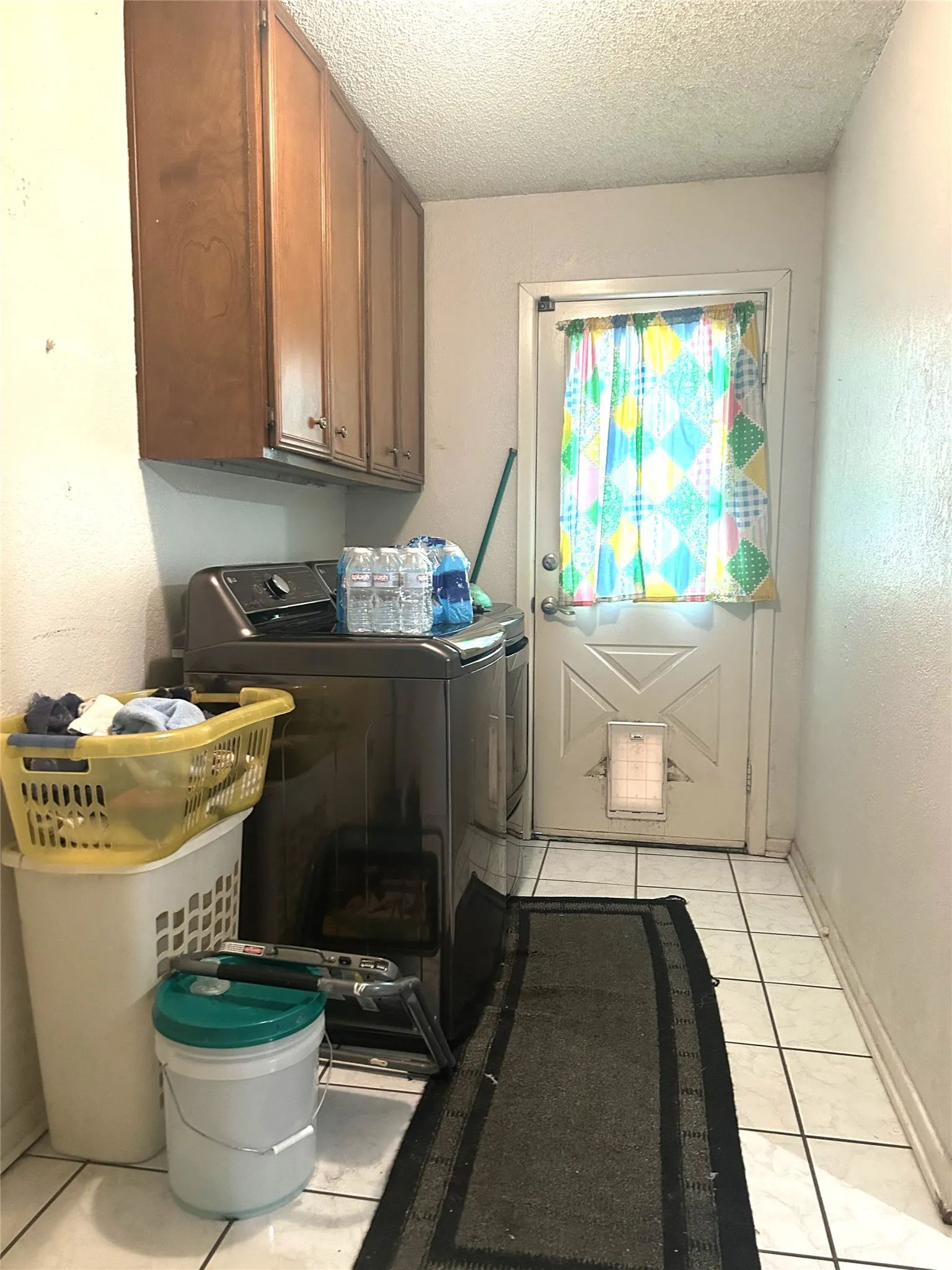 Nice size laundry room with some extra space for a bench, freezer or hampers