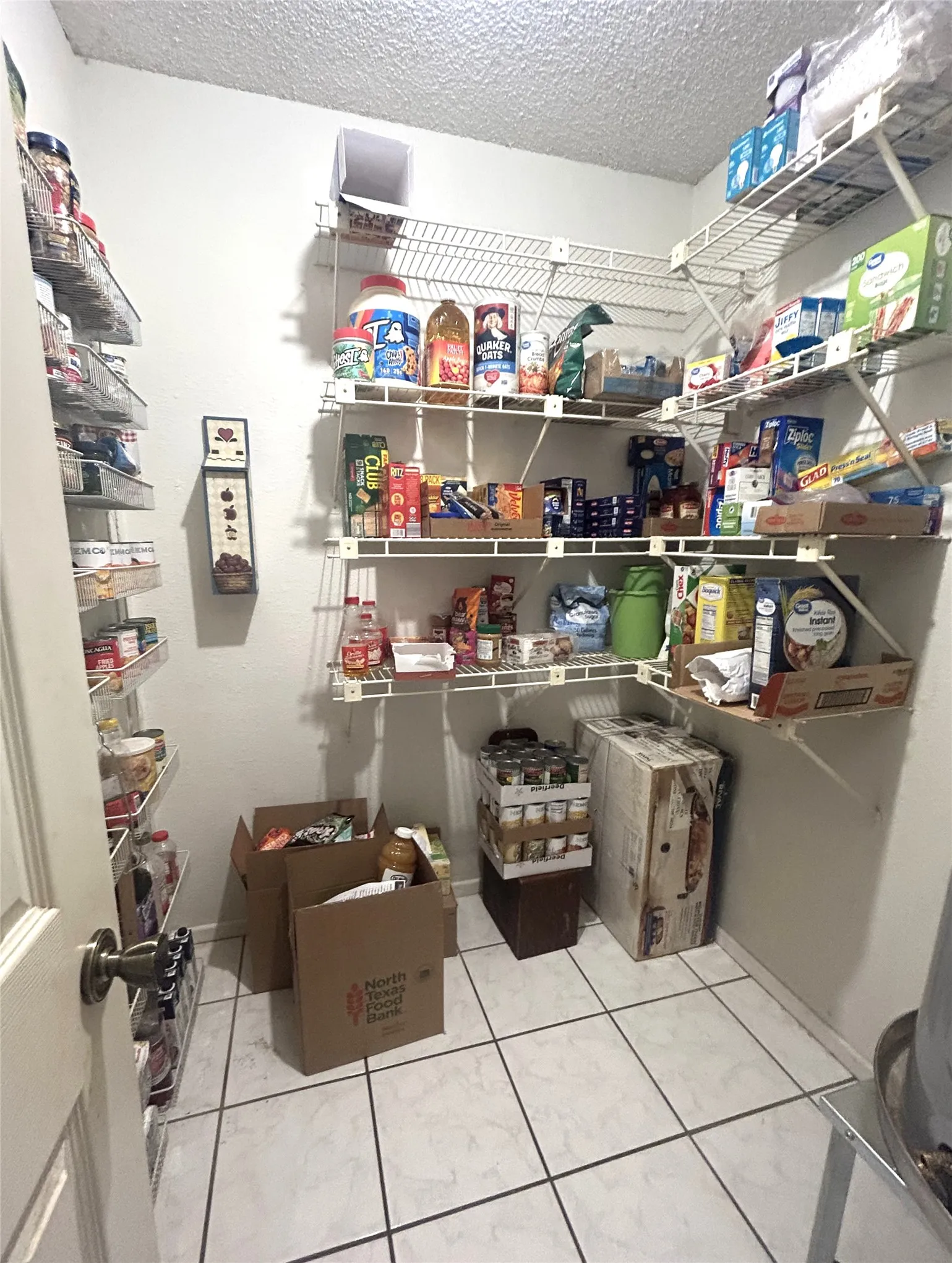 6 X 6 Pantry with shelves, tile floors and Water Heater