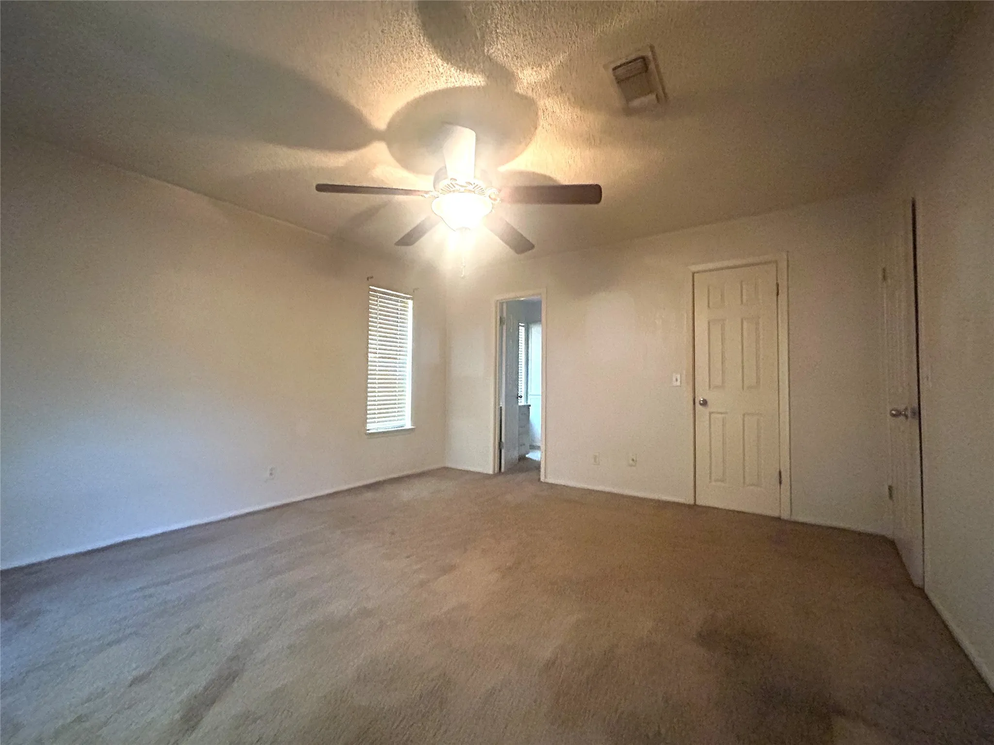 Primary Bedroom with ceiling fan