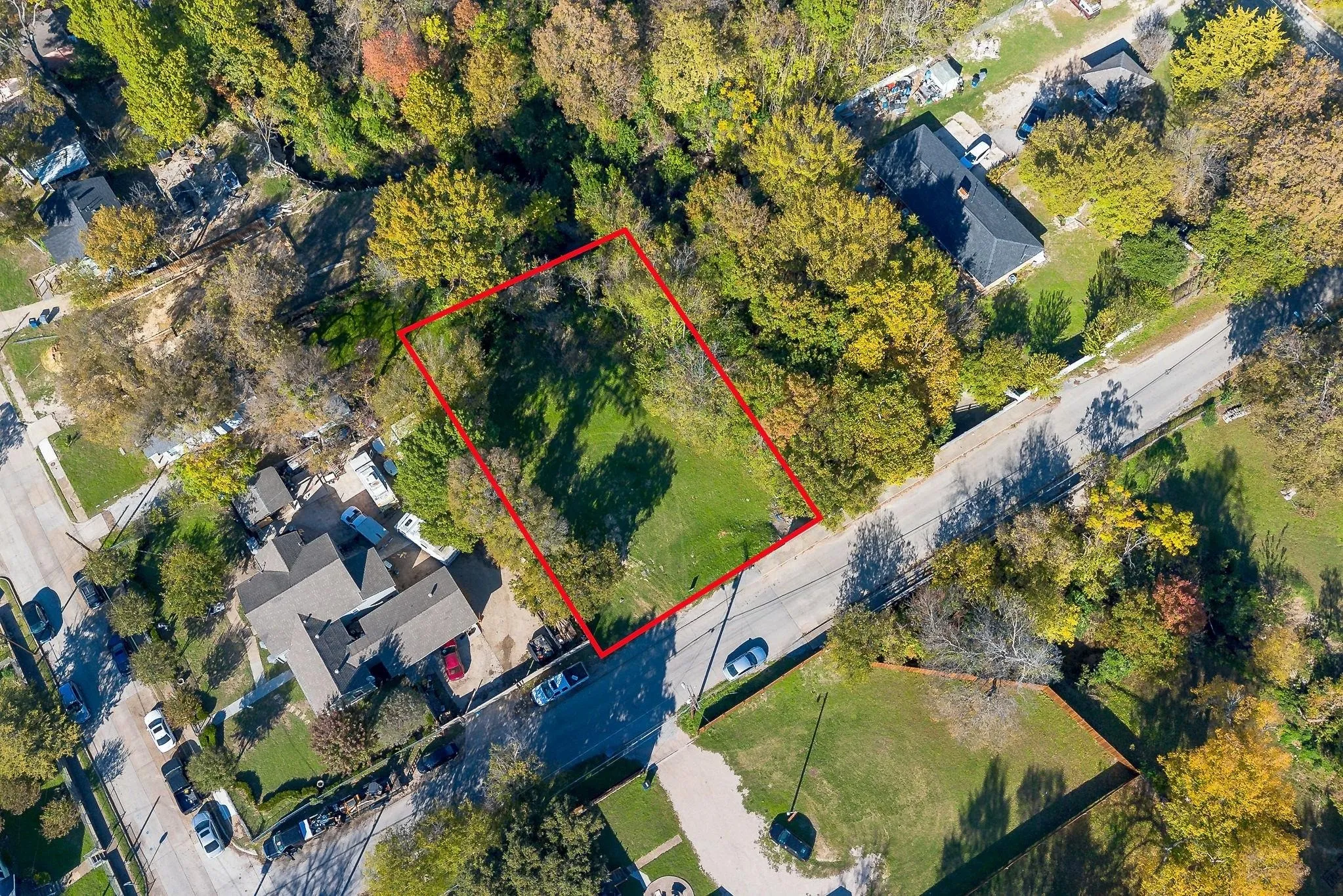 Expansive lot with mature trees and direct street access