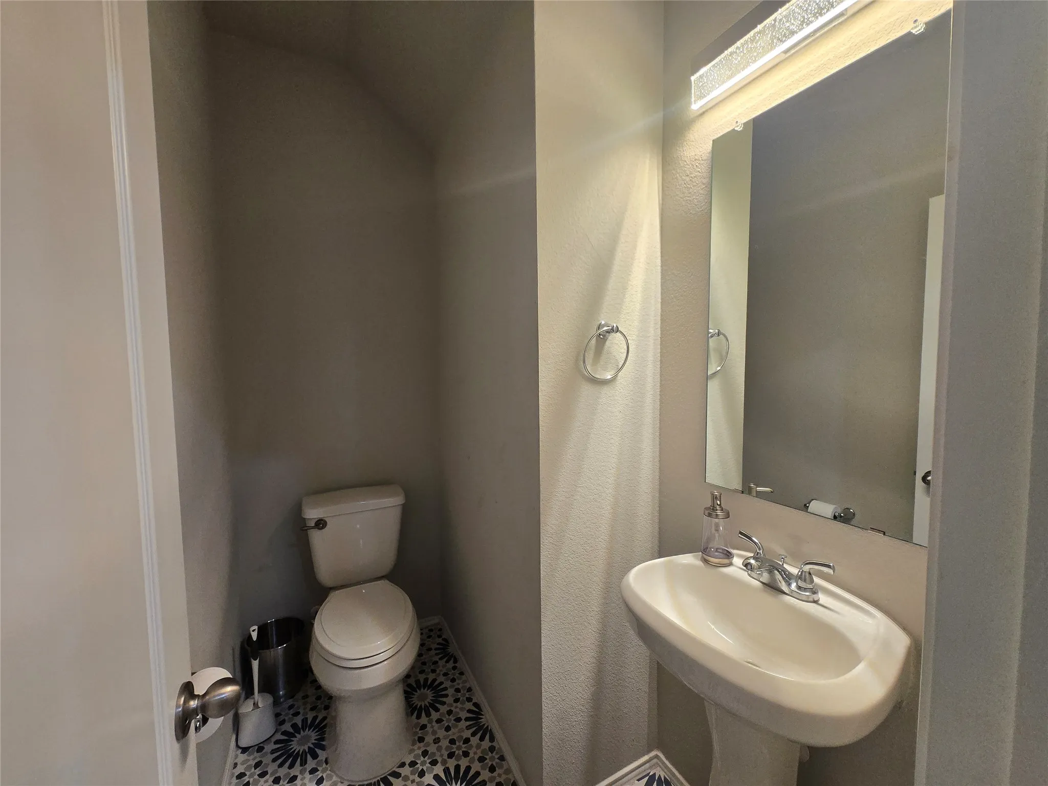 Half bathroom located down stairs