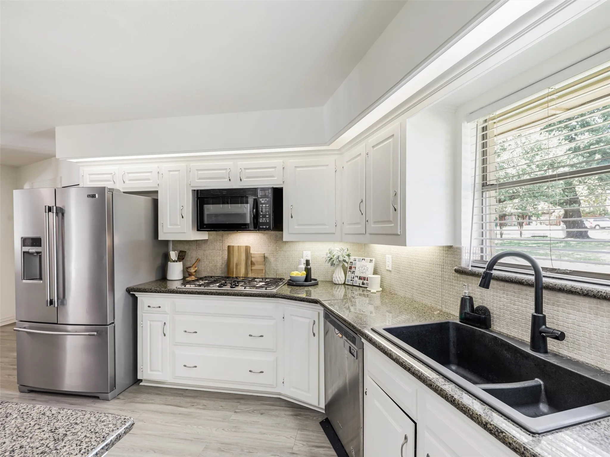 Window over the sink. gas range, double ovens