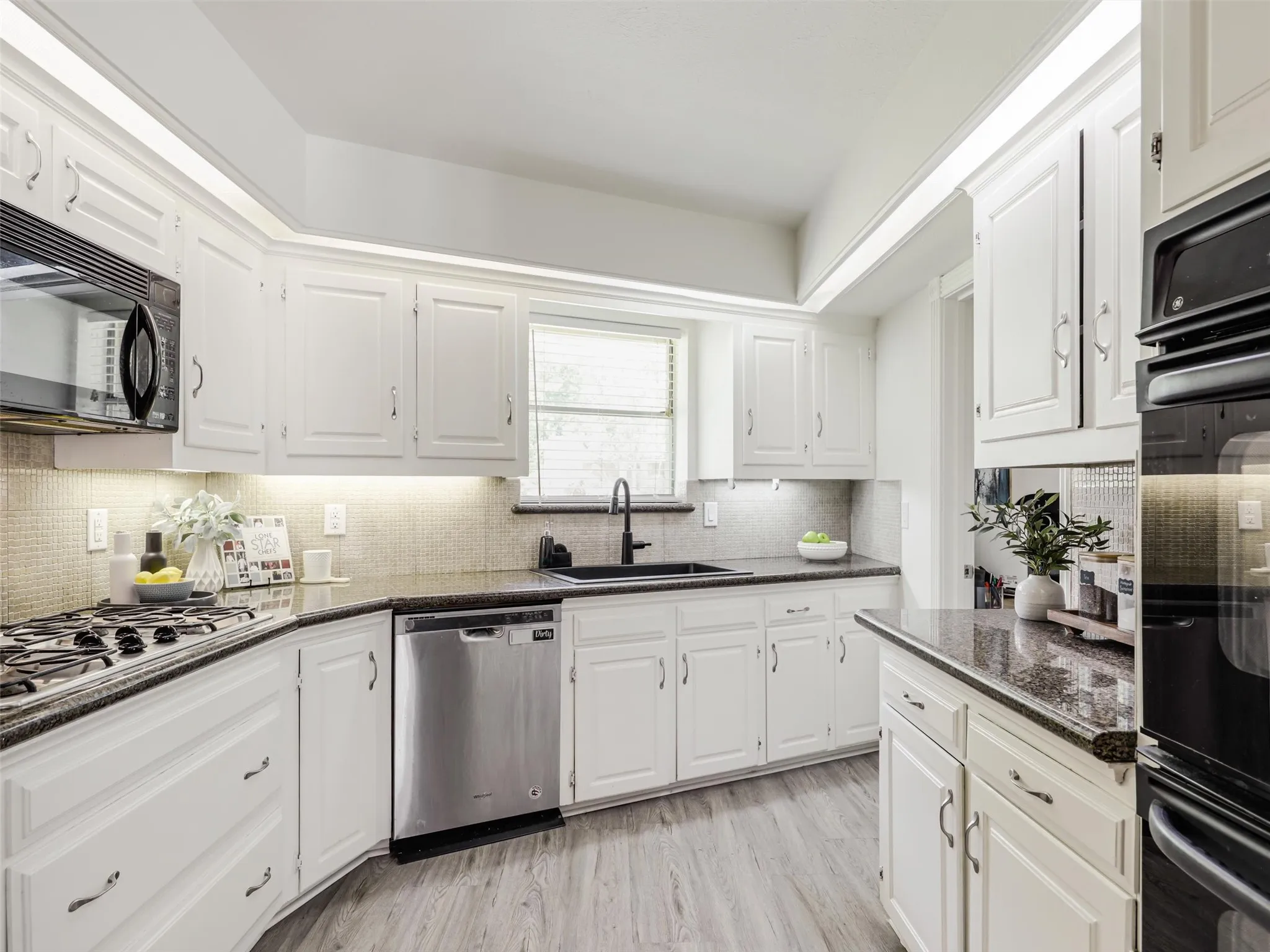 Window over the sink. gas range, double ovens