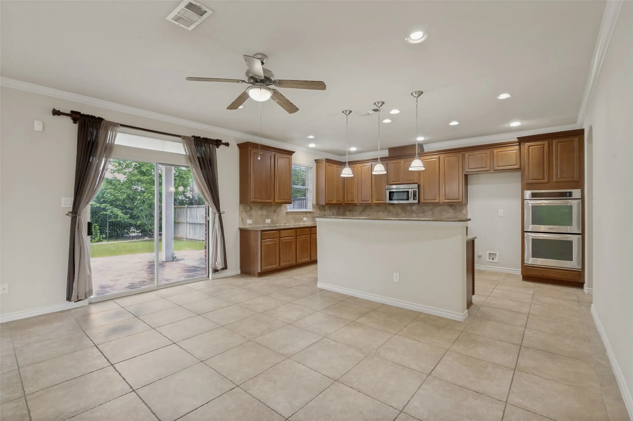 Kitchen with patio doors to back patio and yard