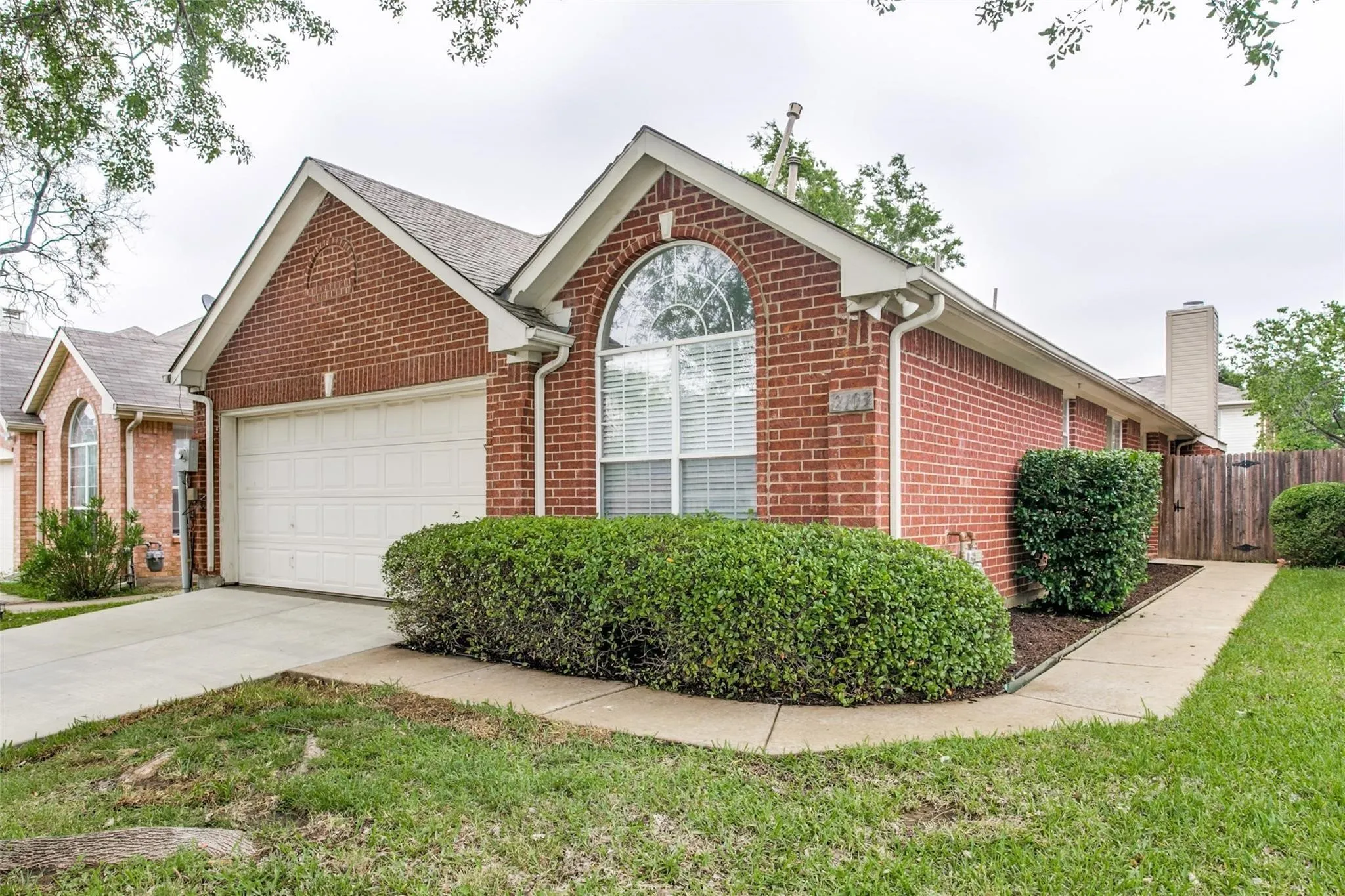 Red brick exterior with white trim